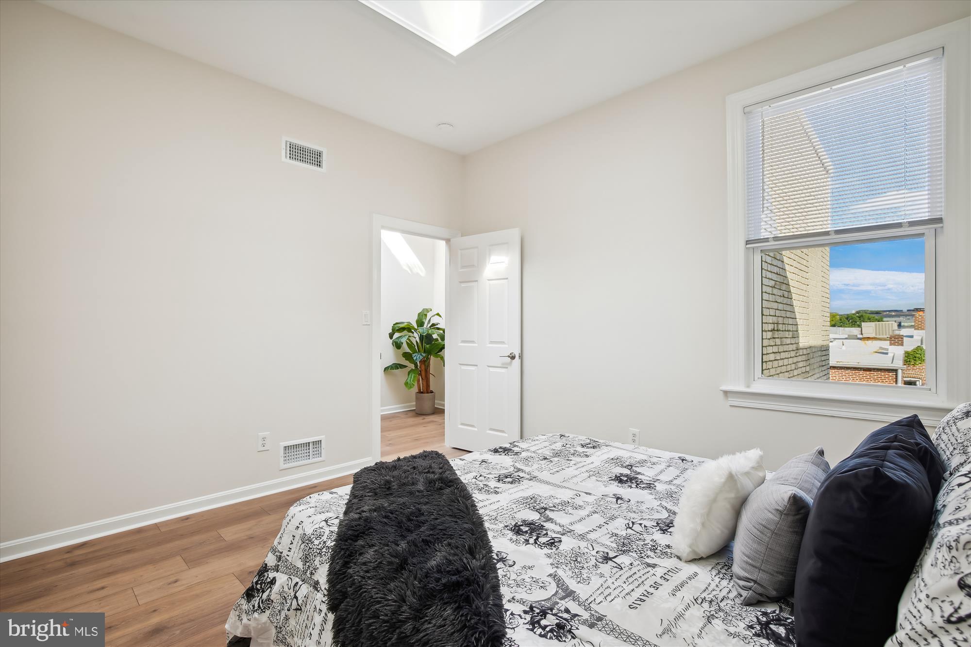 616 E Street Northeast Washington, DC 20002 - Photo 45 of 79 a bedroom with a bed and a window