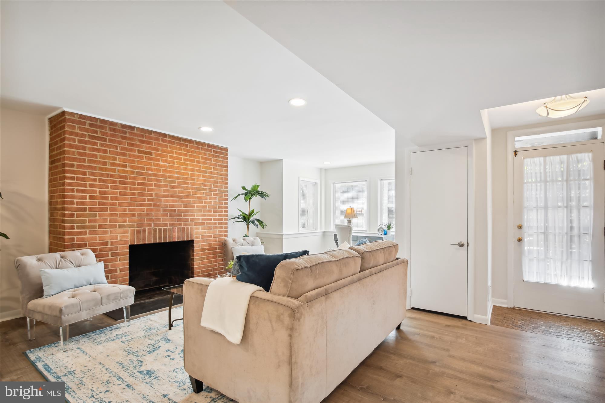 616 E Street Northeast Washington, DC 20002 - Photo 50 of 79 a living room with furniture and a fireplace