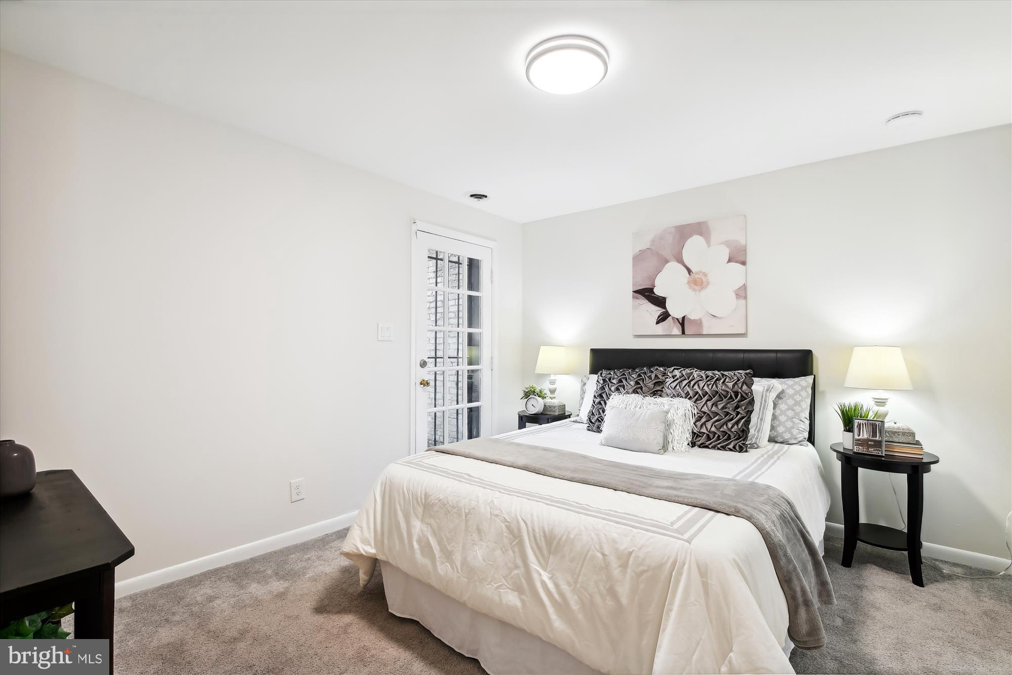 616 E Street Northeast Washington, DC 20002 - Photo 53 of 79 a bedroom with a bed and a night stand