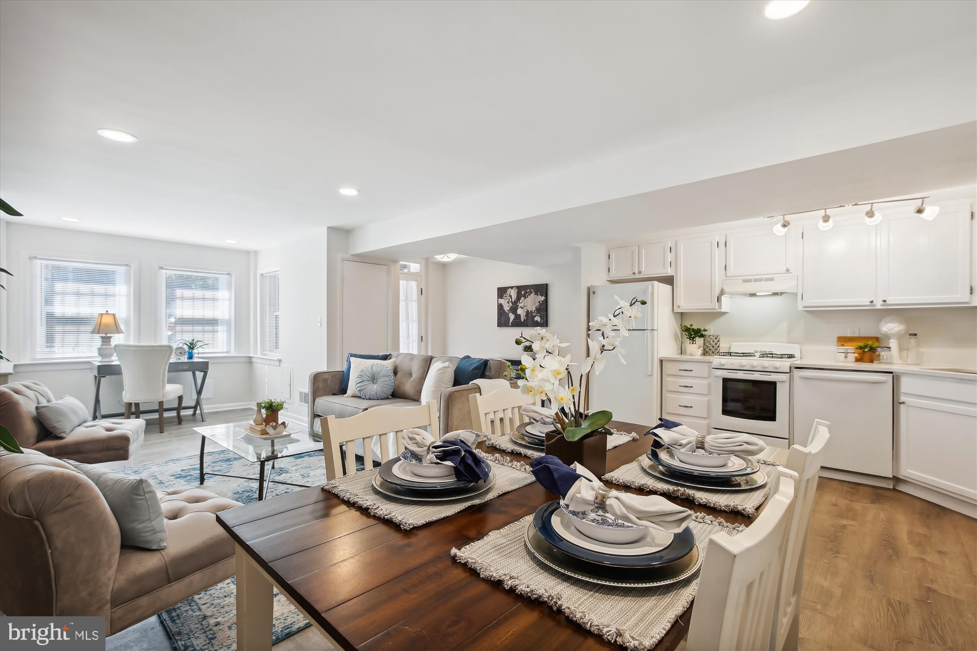 616 E Street Northeast Washington, DC 20002 - Photo 55 of 79 a living room with furniture kitchen and a wooden floor