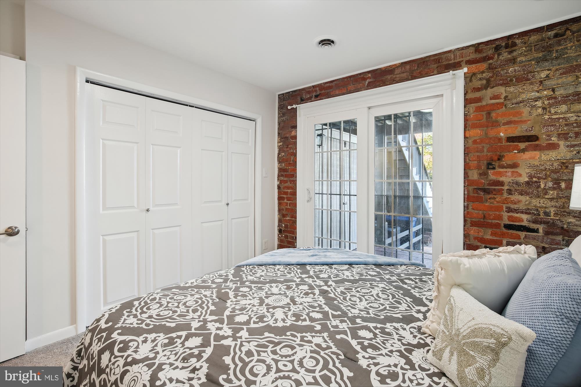 616 E Street Northeast Washington, DC 20002 - Photo 59 of 79 a bedroom with a bed and a window with chair
