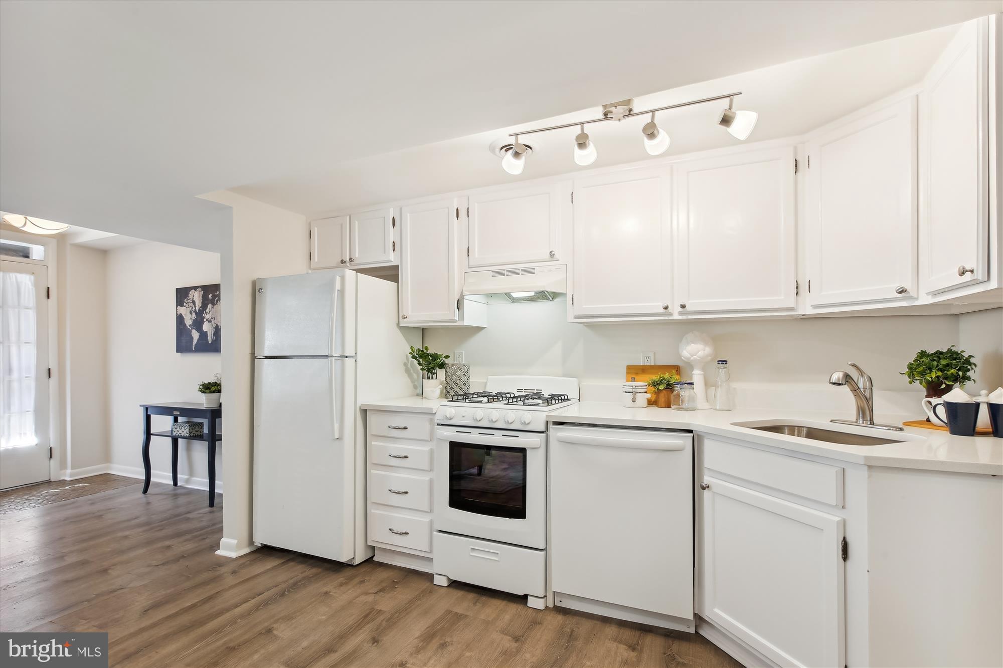 616 E Street Northeast Washington, DC 20002 - Photo 62 of 79 a kitchen with white cabinets and white appliances