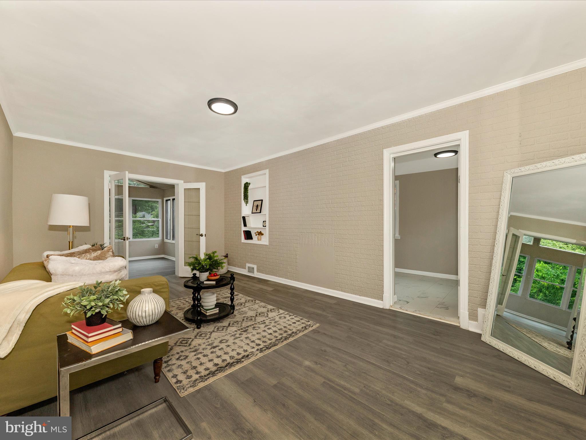 8709 Bradford Road Silver Spring, MD 20901 - Photo 15 of 51 a bed room with furniture and wooden floor