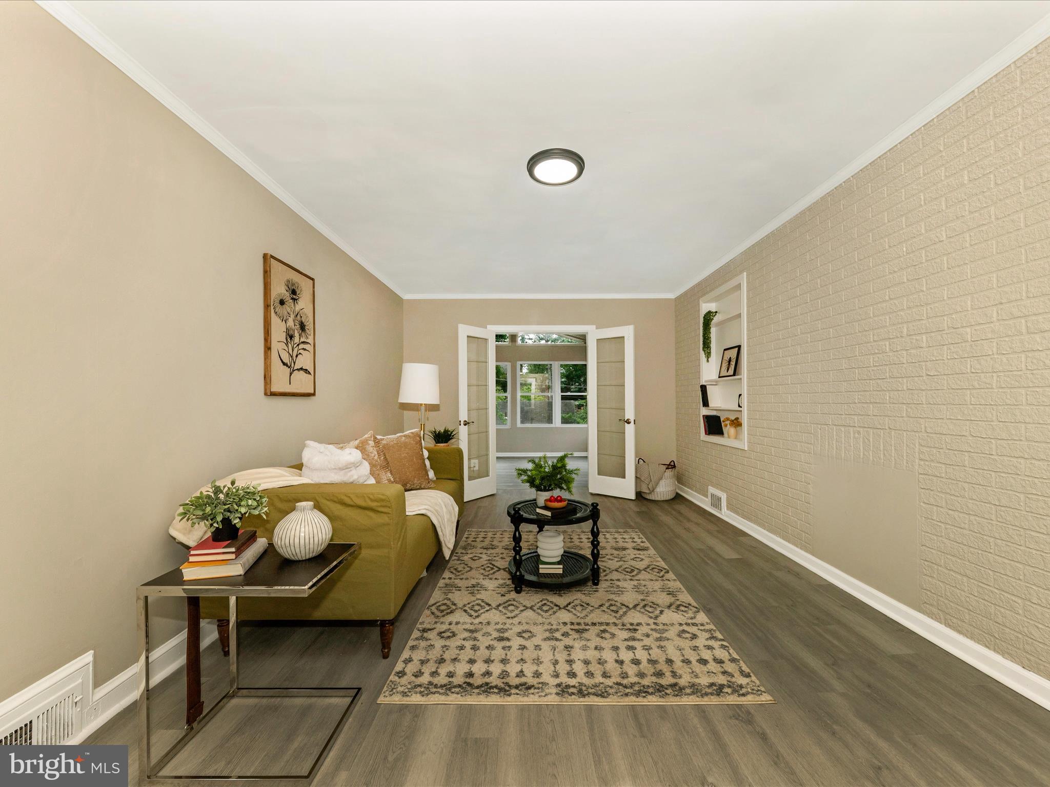 8709 Bradford Road Silver Spring, MD 20901 - Photo 16 of 51 a living room with furniture and a table