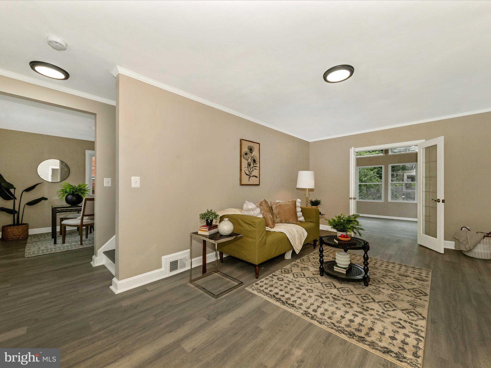 8709 Bradford Road Silver Spring, MD 20901 - Photo 17 of 51 a living room with furniture and wooden floor