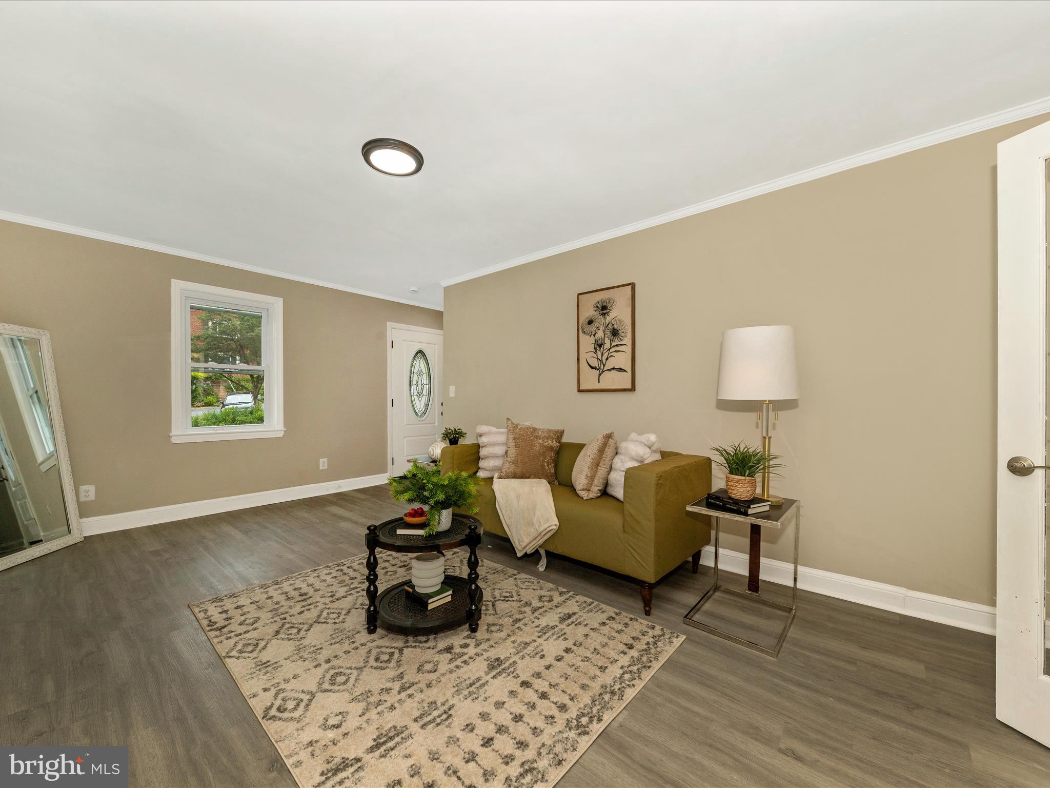 8709 Bradford Road Silver Spring, MD 20901 - Photo 18 of 51 a living room with furniture and a window
