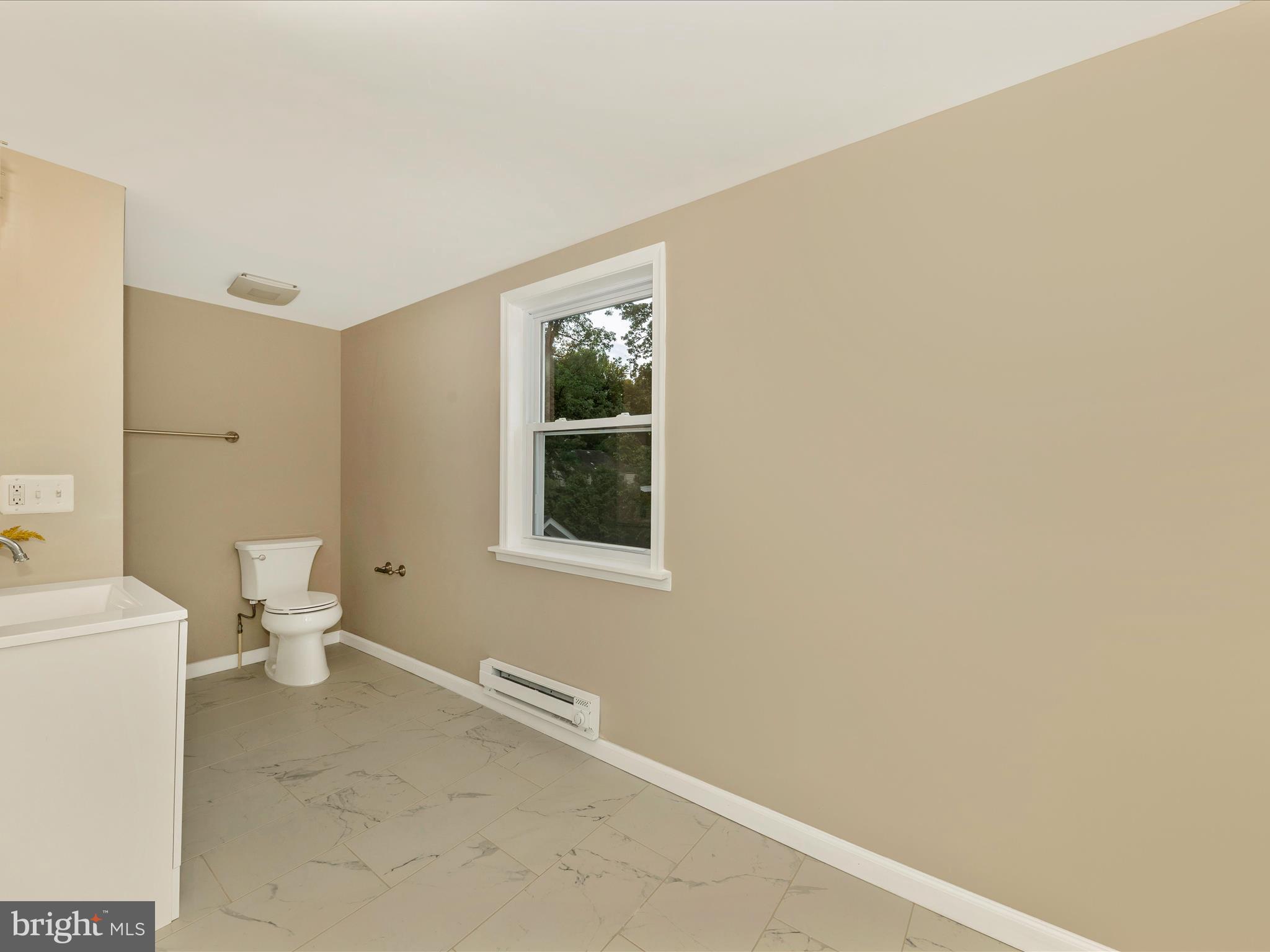 8709 Bradford Road Silver Spring, MD 20901 - Photo 20 of 51 a bathroom with a toilet