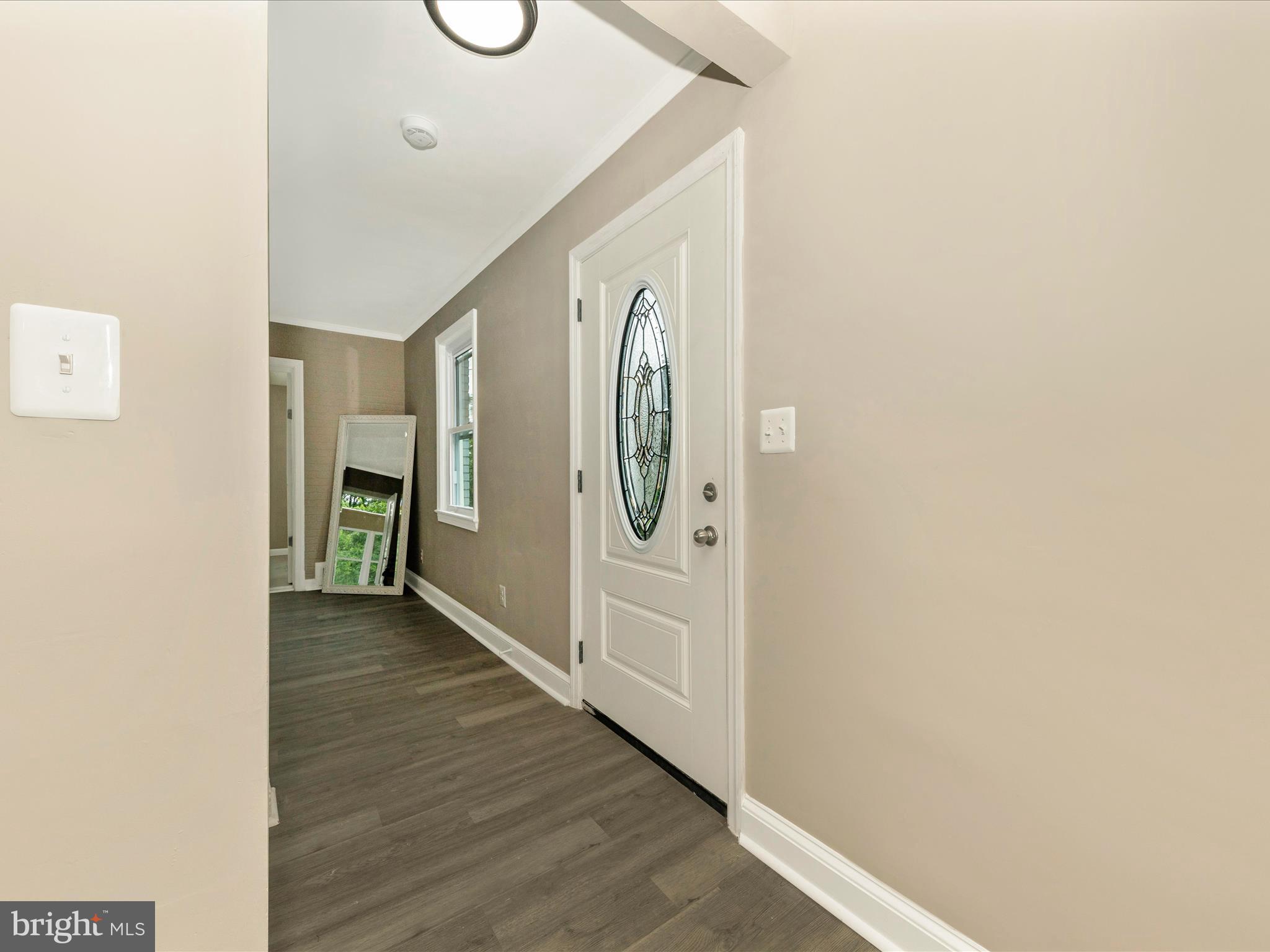 8709 Bradford Road Silver Spring, MD 20901 - Photo 2 of 51 a view of livingroom with hallway and wooden floor