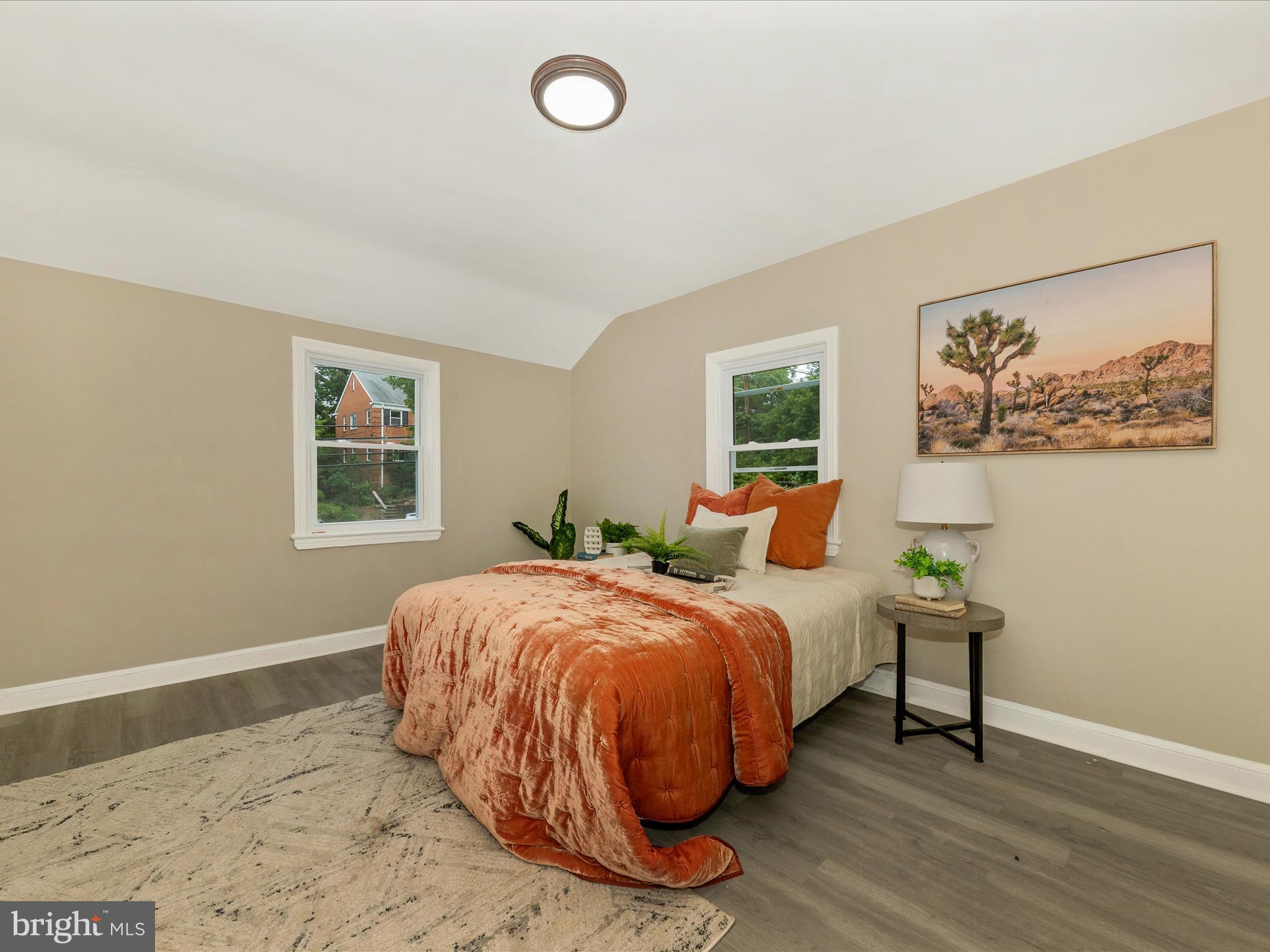8709 Bradford Road Silver Spring, MD 20901 - Photo 23 of 51 a bedroom with a bed and wooden floor