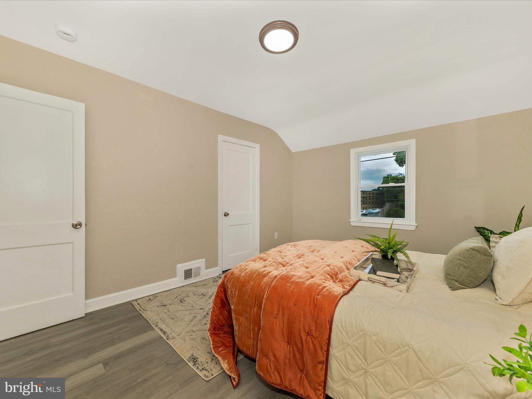 8709 Bradford Road Silver Spring, MD 20901 - Photo 24 of 51 a bedroom with a bed and a window