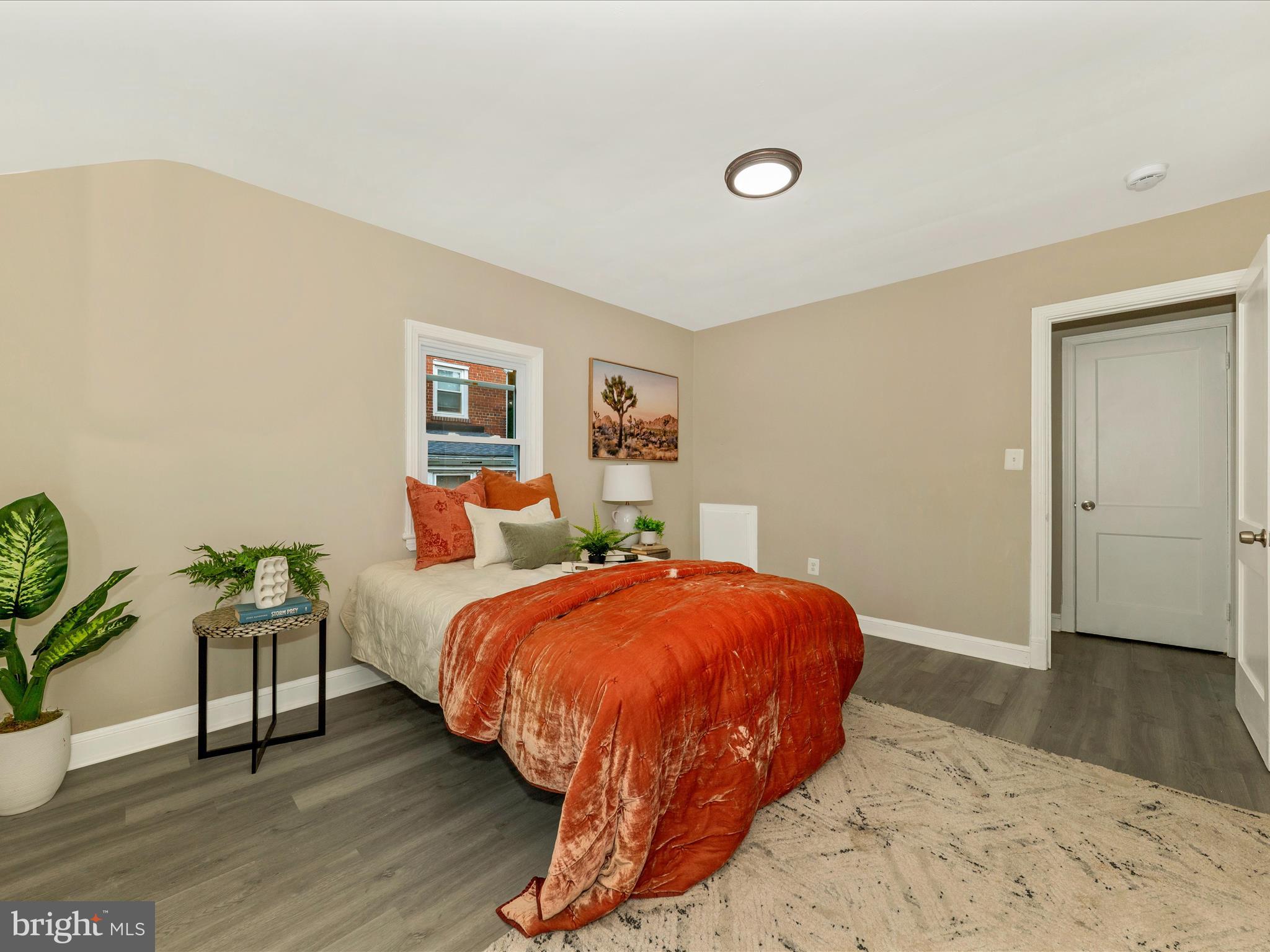8709 Bradford Road Silver Spring, MD 20901 - Photo 25 of 51 a bedroom with a bed and wooden floor