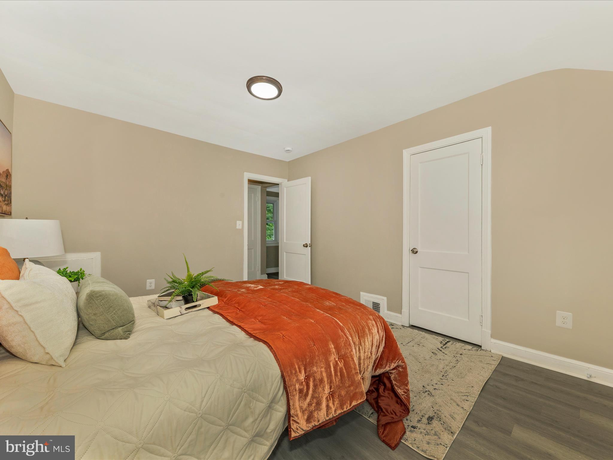 8709 Bradford Road Silver Spring, MD 20901 - Photo 26 of 51 a bedroom with a bed and a window