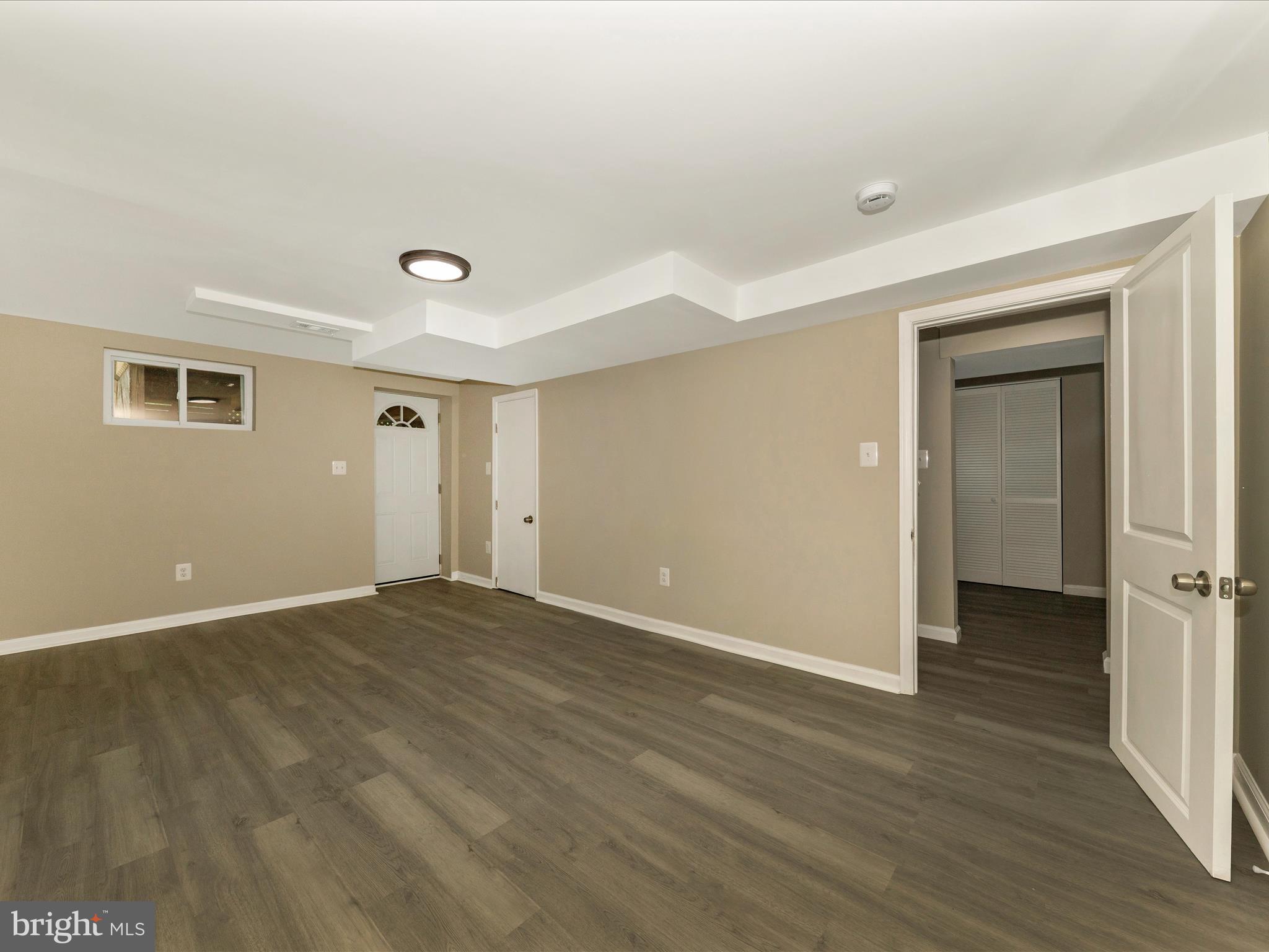 8709 Bradford Road Silver Spring, MD 20901 - Photo 34 of 51 a view of an empty room with wooden floor and closet