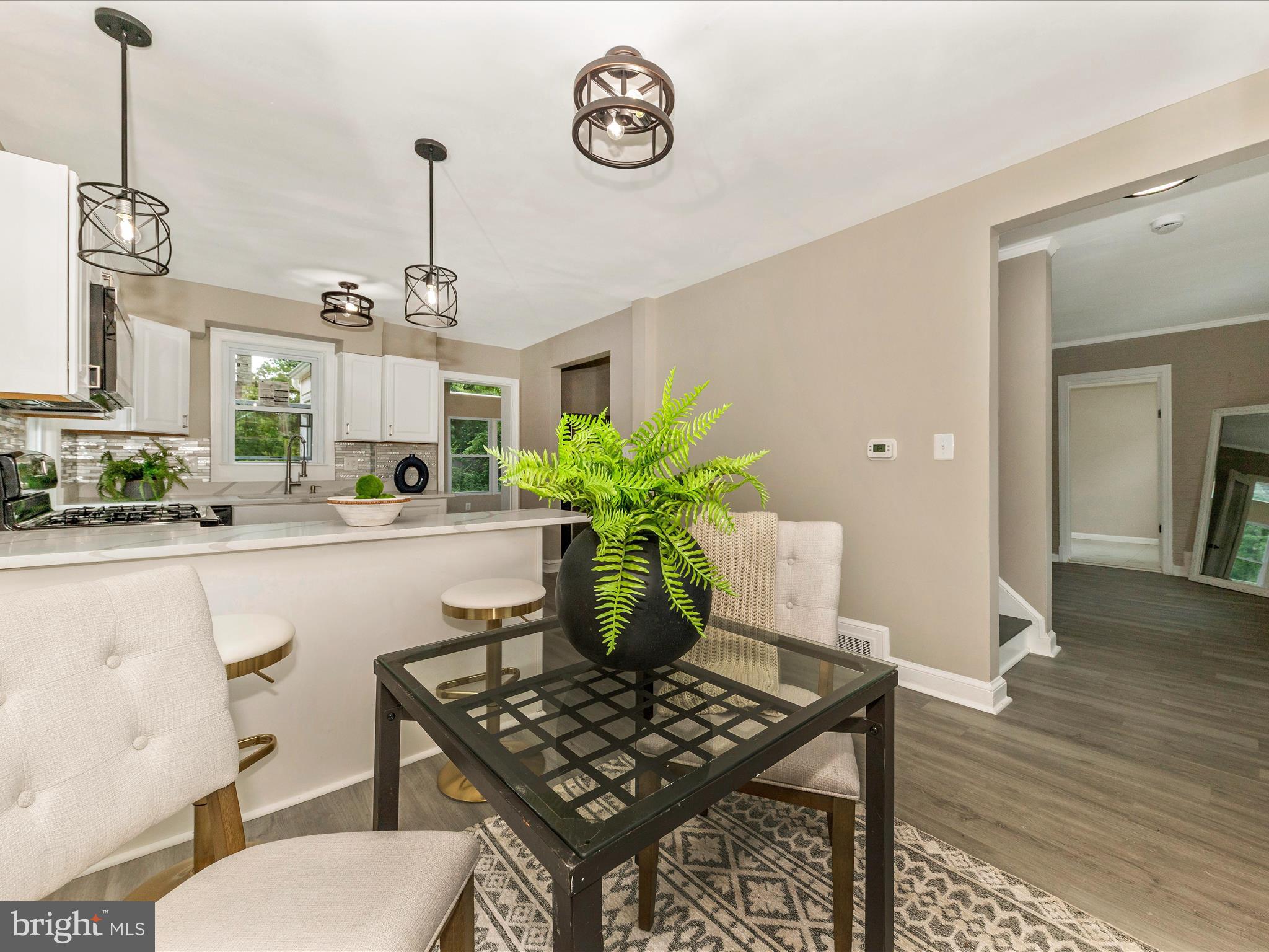 8709 Bradford Road Silver Spring, MD 20901 - Photo 4 of 51 a view of kitchen and dining area with furniture