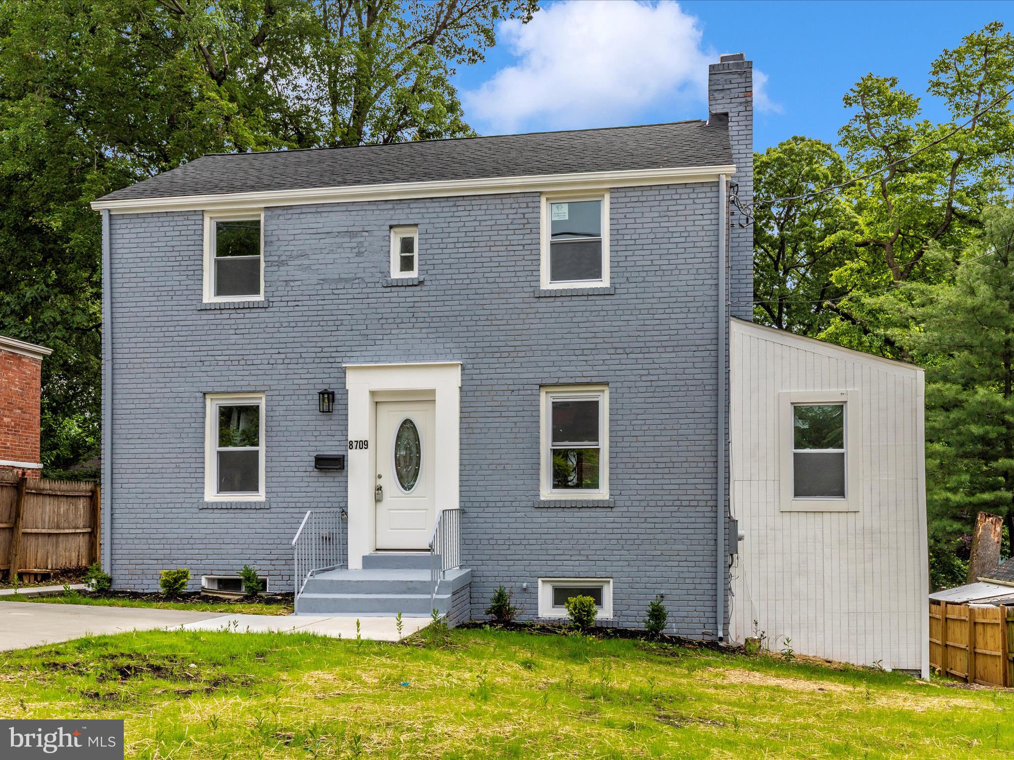 8709 Bradford Road Silver Spring, MD 20901 - Photo 41 of 51 a front view of a house with a yard