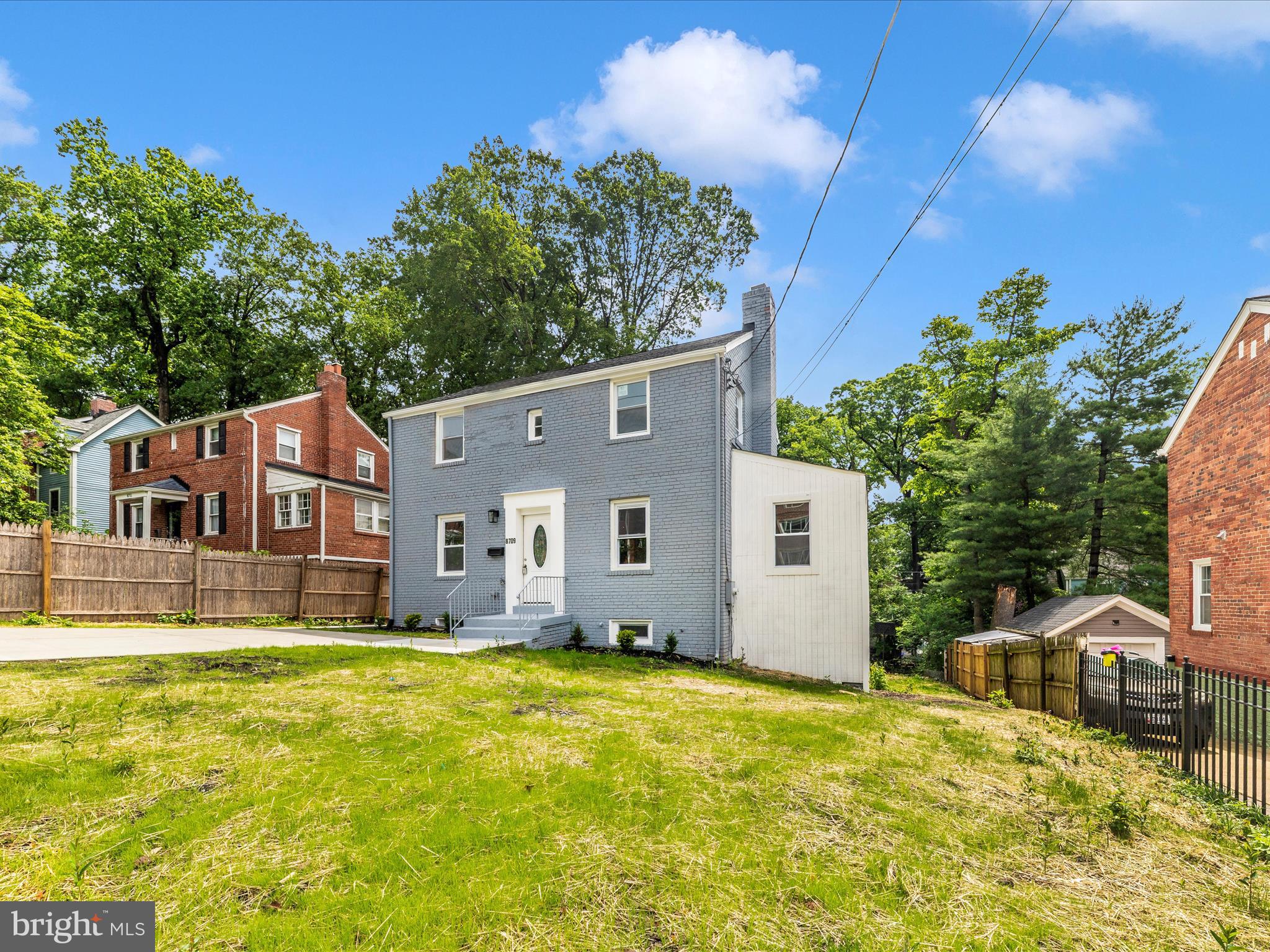 8709 Bradford Road Silver Spring, MD 20901 - Photo 42 of 51 a house view with a swimming pool