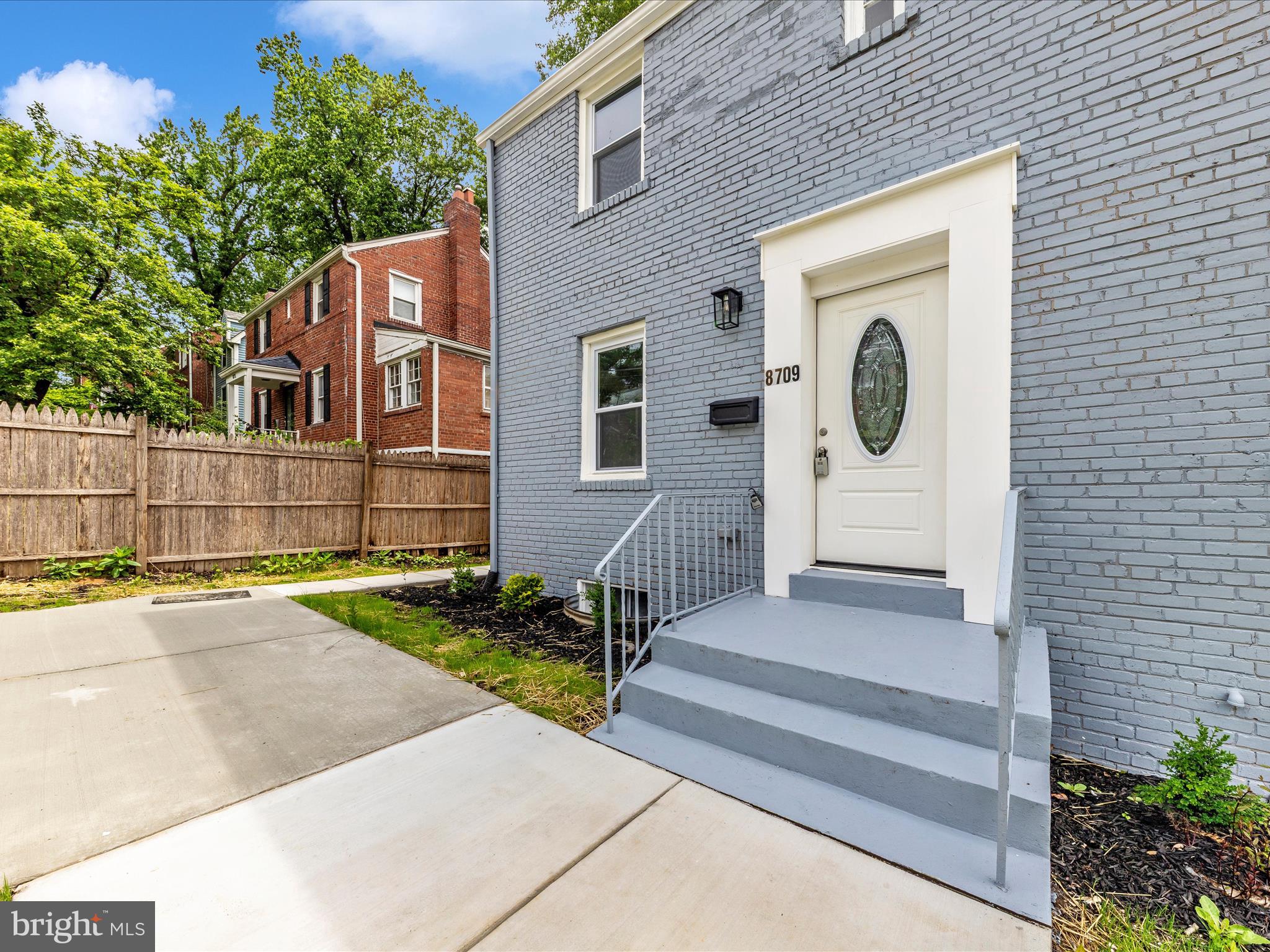 8709 Bradford Road Silver Spring, MD 20901 - Photo 44 of 51 a front view of a house with garden