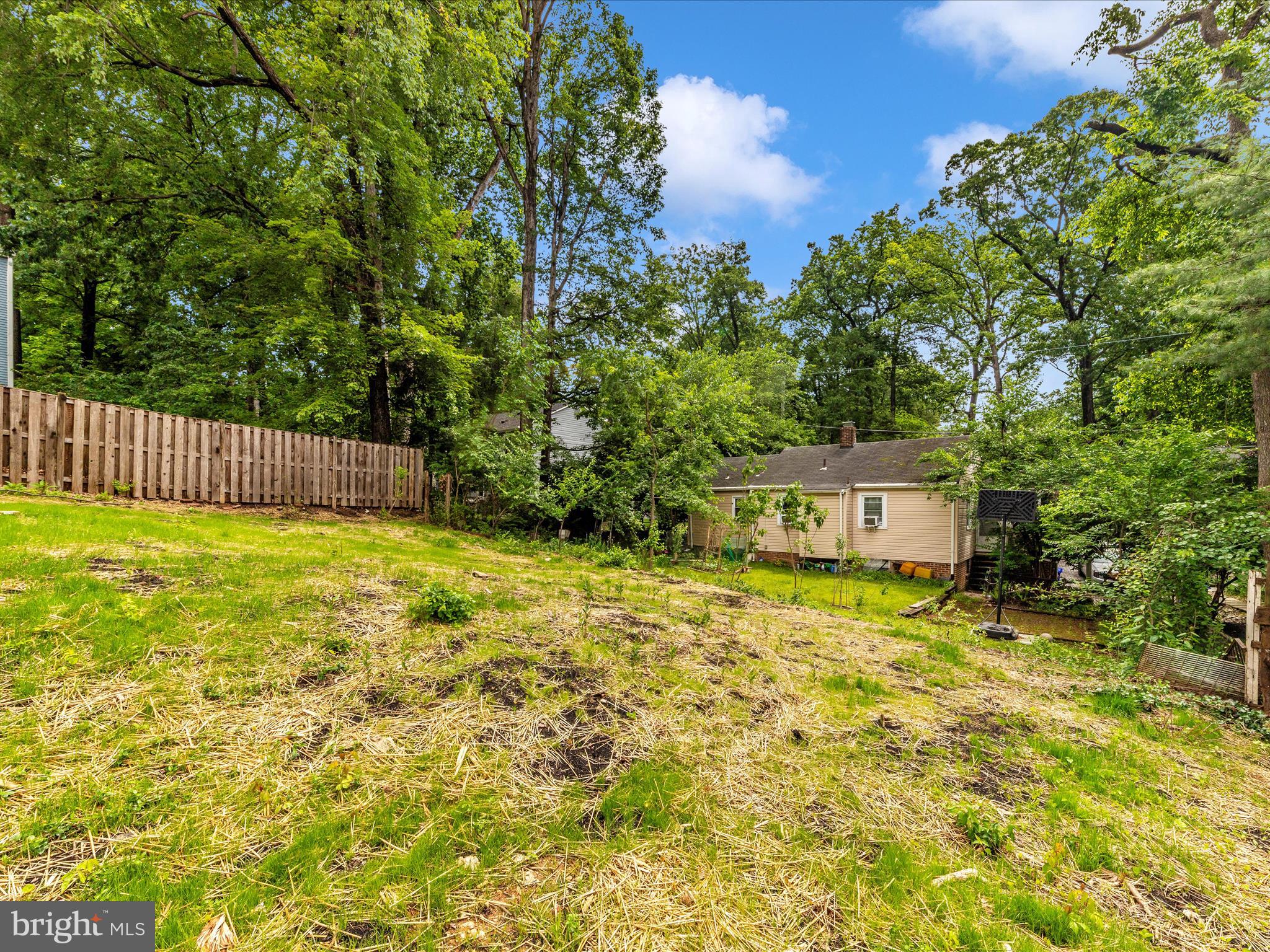 8709 Bradford Road Silver Spring, MD 20901 - Photo 49 of 51 a house view with swimming pool in front of it