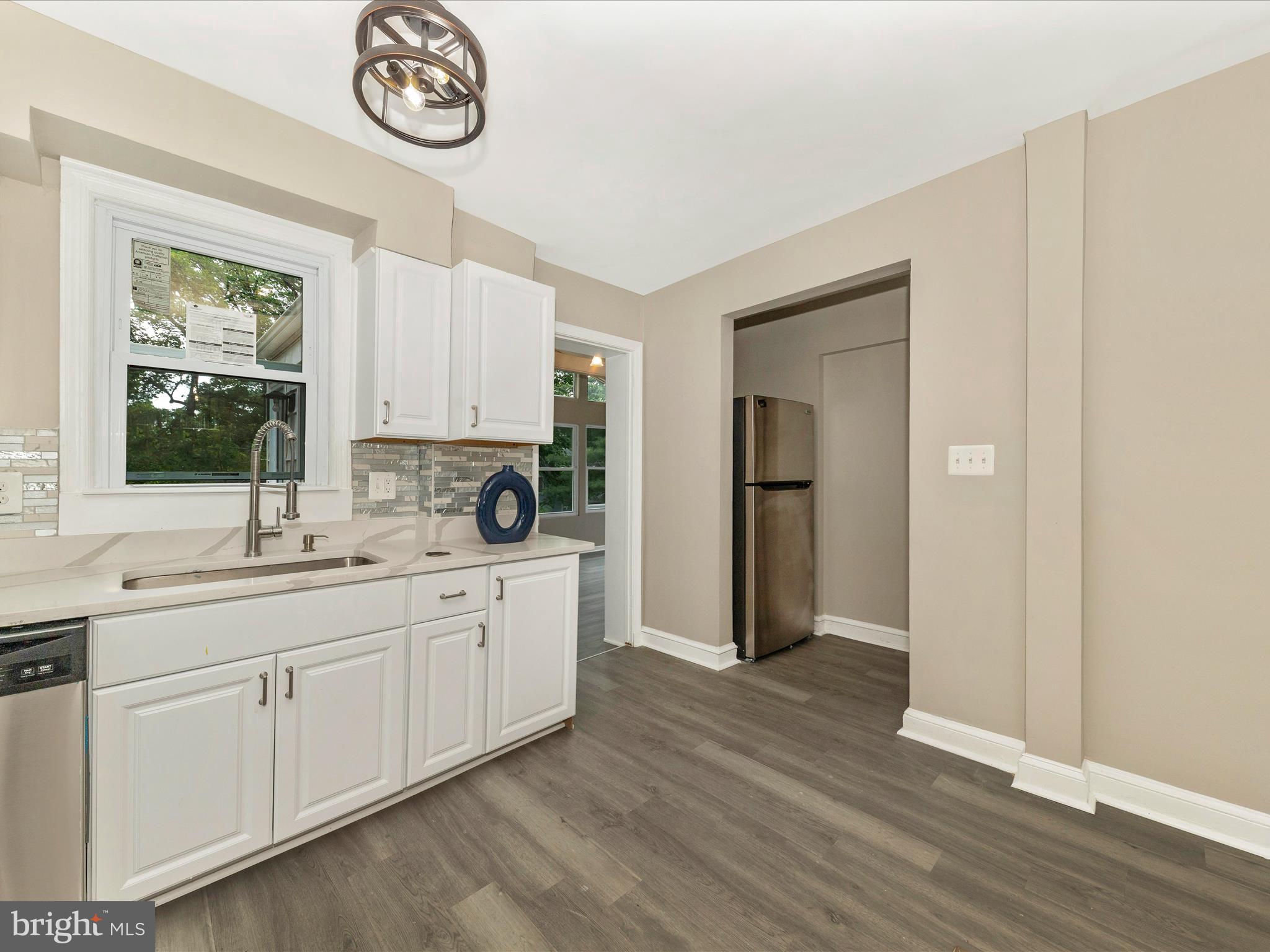 8709 Bradford Road Silver Spring, MD 20901 - Photo 9 of 51 a view of a kitchen counter space and a window