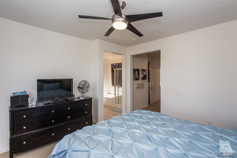 3012 North Ventura Road Oxnard, CA 93036 - Photo 15 of 29 a bedroom with a bed and a flat tv screen on a dresser