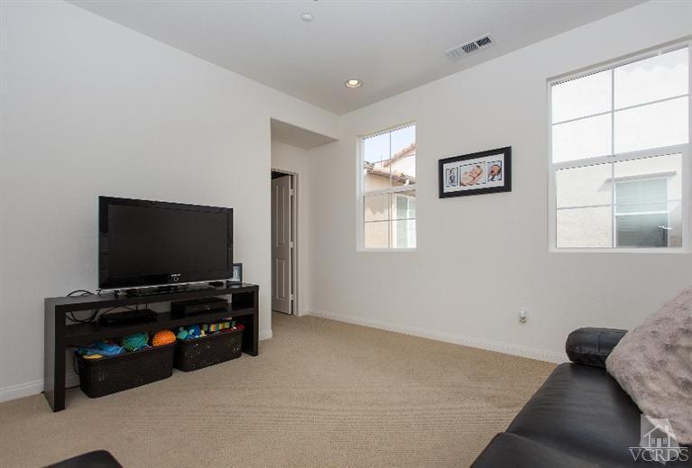 3012 North Ventura Road Oxnard, CA 93036 - Photo 21 of 29 a living room with furniture and a flat screen tv