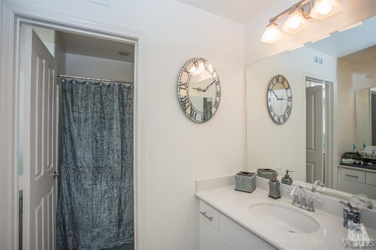 3012 North Ventura Road Oxnard, CA 93036 - Photo 22 of 29 a bathroom with a sink and a mirror
