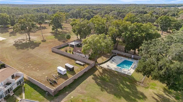 an aerial view of house with yard