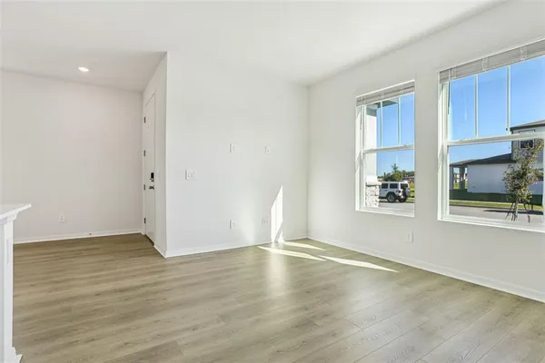 a kitchen with cabinets a refrigerator and a sink