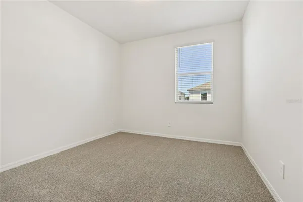 an empty room with white walls