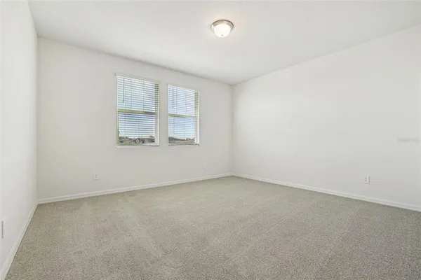 a front view of a house with a yard and a garage