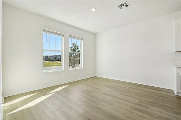 a view of kitchen with wooden floor