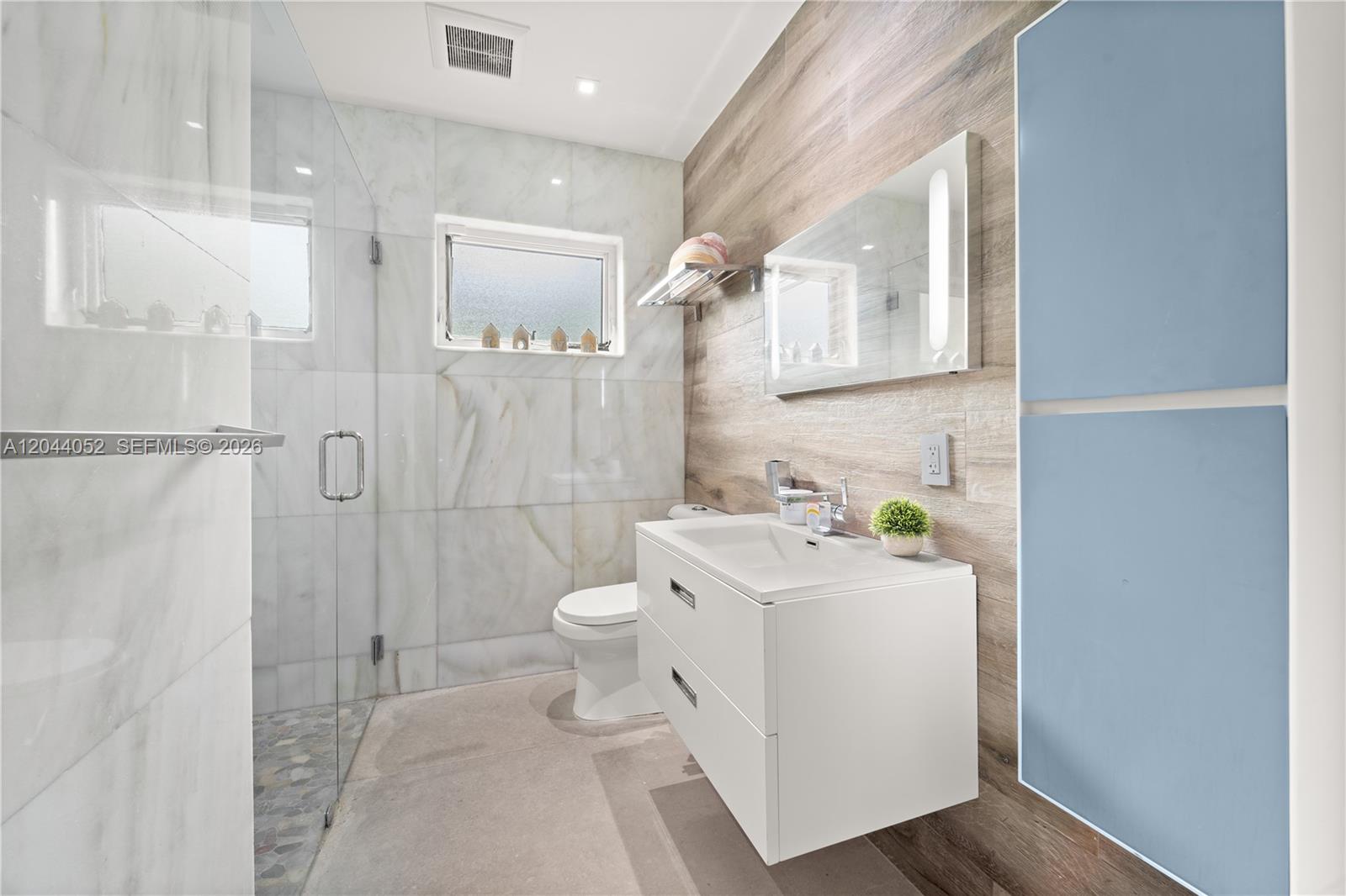 721 Bird Road Coral Gables, FL 33146 - Photo 11 of 24 a bathroom with a sink toilet and shower