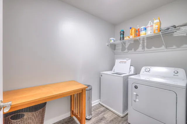 a bedroom with a large bed and ceiling fan
