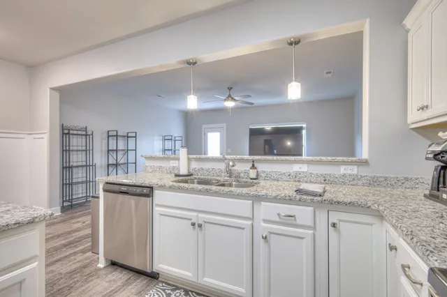 a kitchen with a sink and cabinets