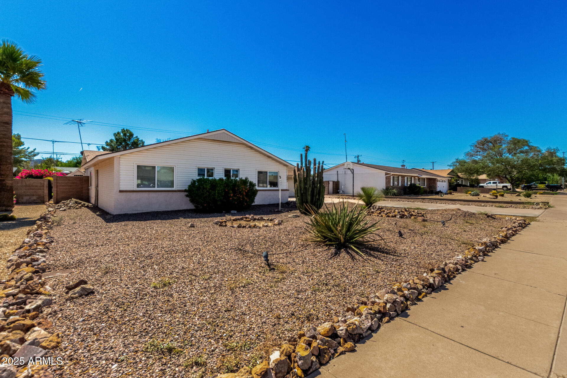 3045 East Cholla Street Phoenix, AZ 85028 - Photo 2 of 23 a large tree in front of a house