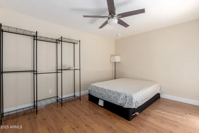 a bedroom with a bed and a dresser