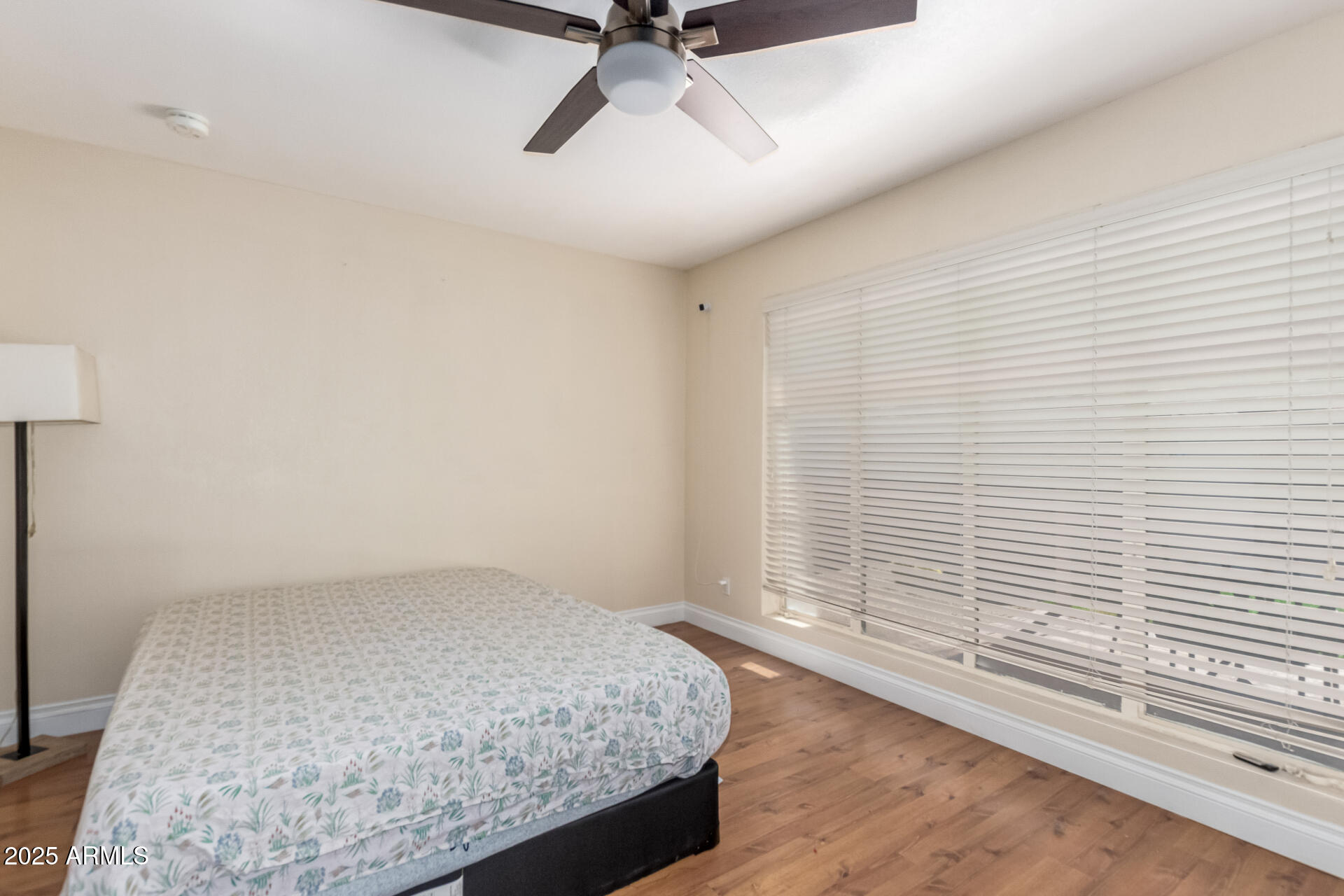 3045 East Cholla Street Phoenix, AZ 85028 - Photo 9 of 23 a view of a livingroom with a ceiling fan and window