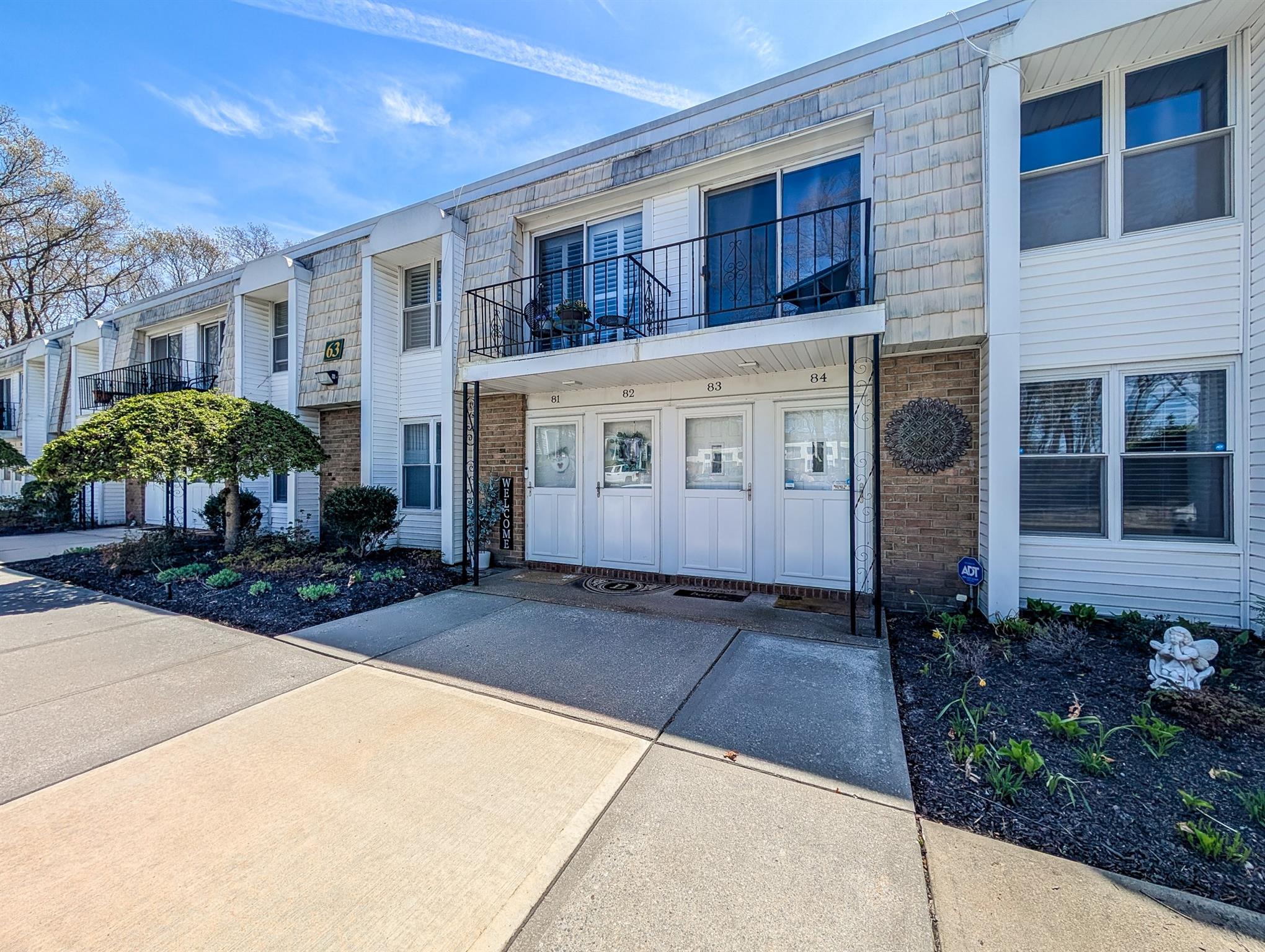Townhome / multi-family property with brick siding