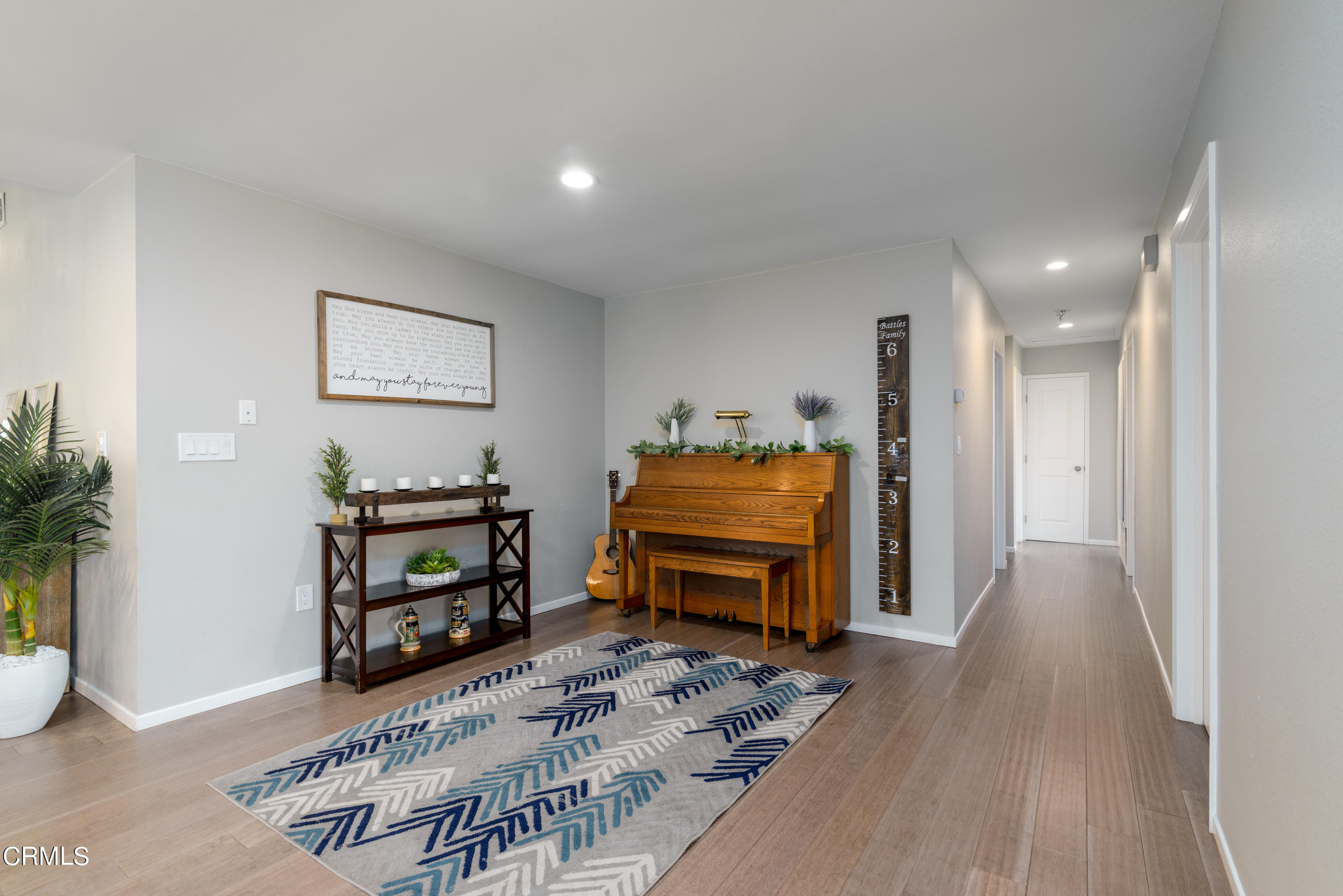 4274 Peach Slope Road Moorpark, CA 93021 - Photo 12 of 27 a living room with furniture and a wooden floor