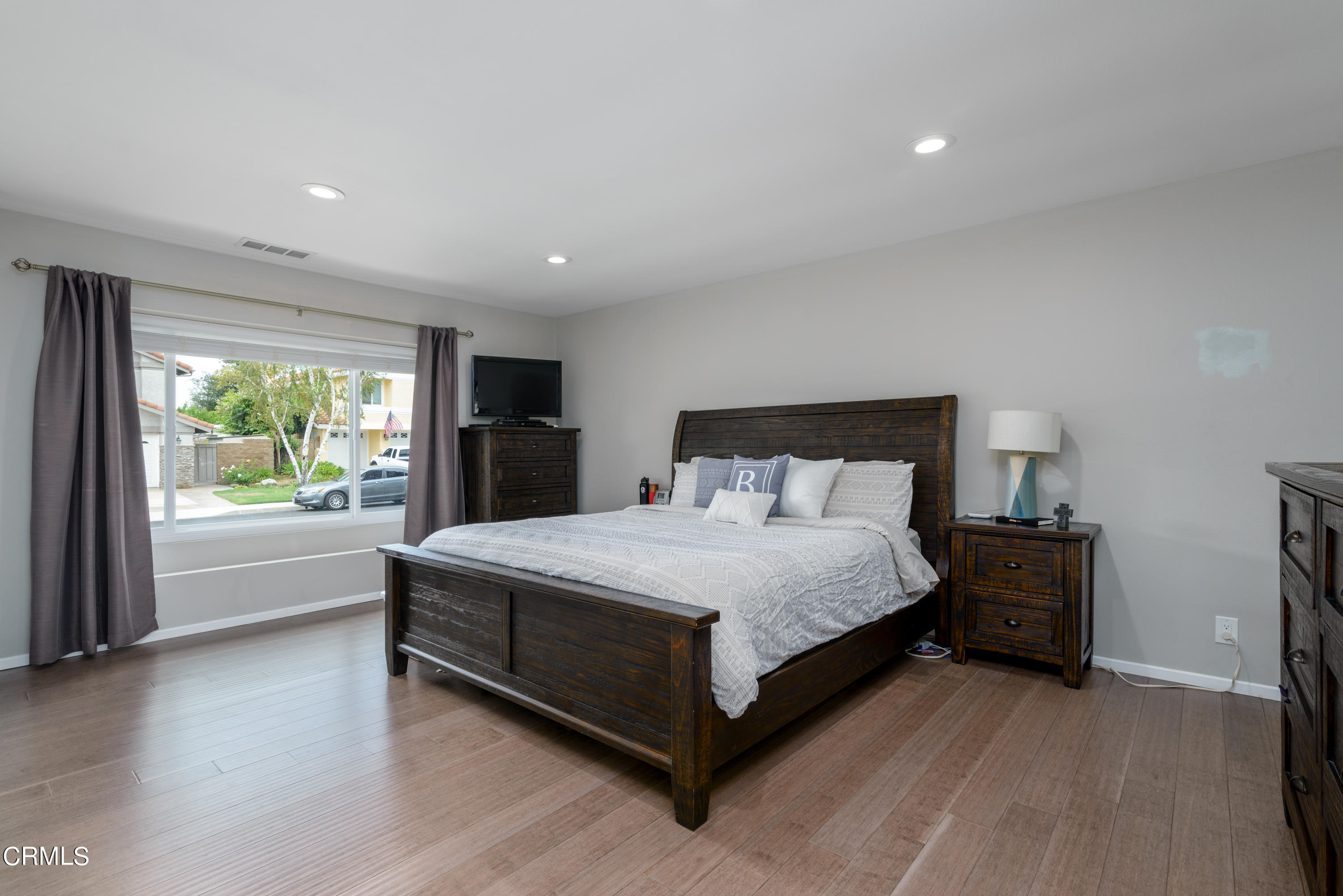 4274 Peach Slope Road Moorpark, CA 93021 - Photo 13 of 27 a bedroom with a large bed and a large window