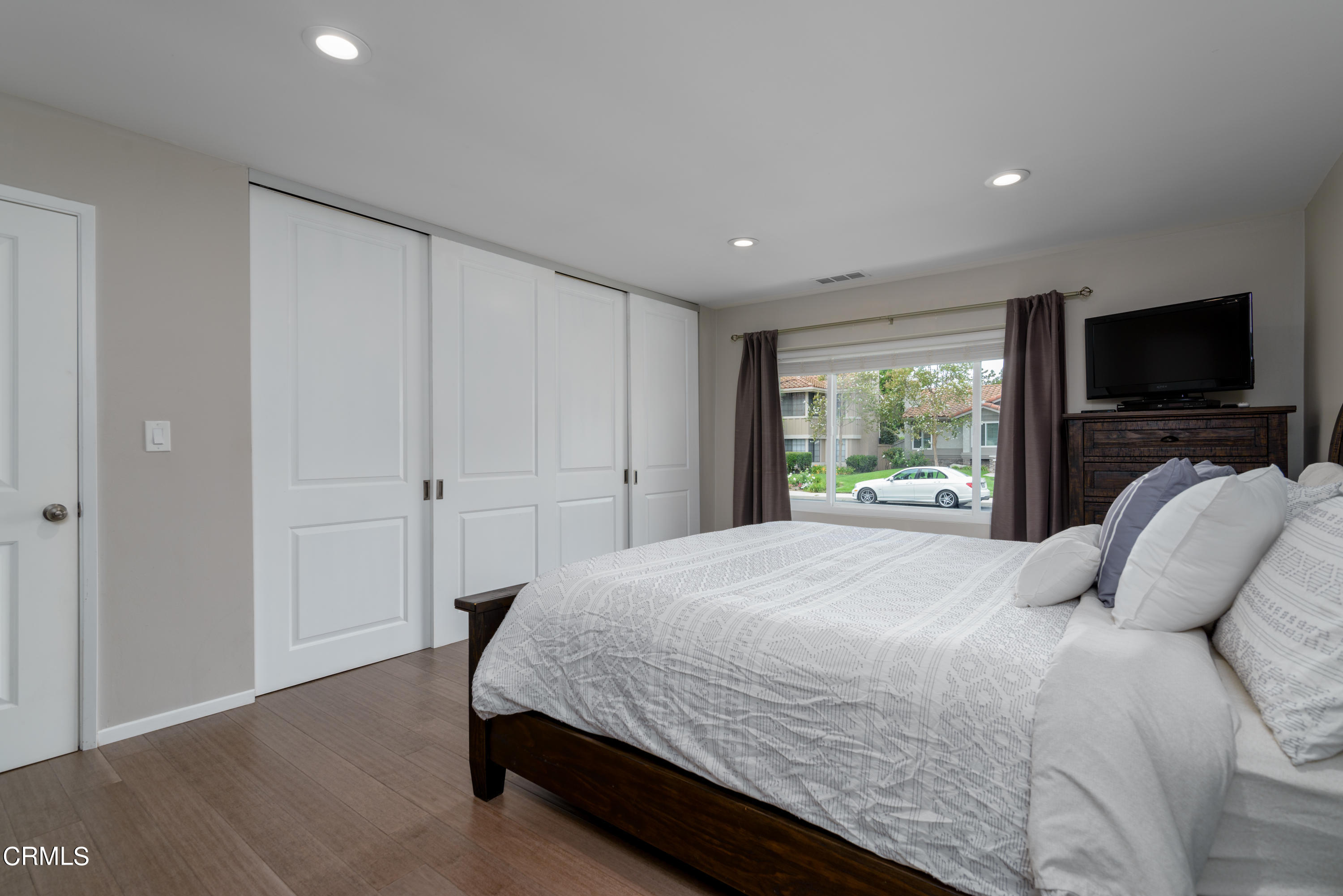 4274 Peach Slope Road Moorpark, CA 93021 - Photo 14 of 27 a bedroom with a bed and a flat screen tv