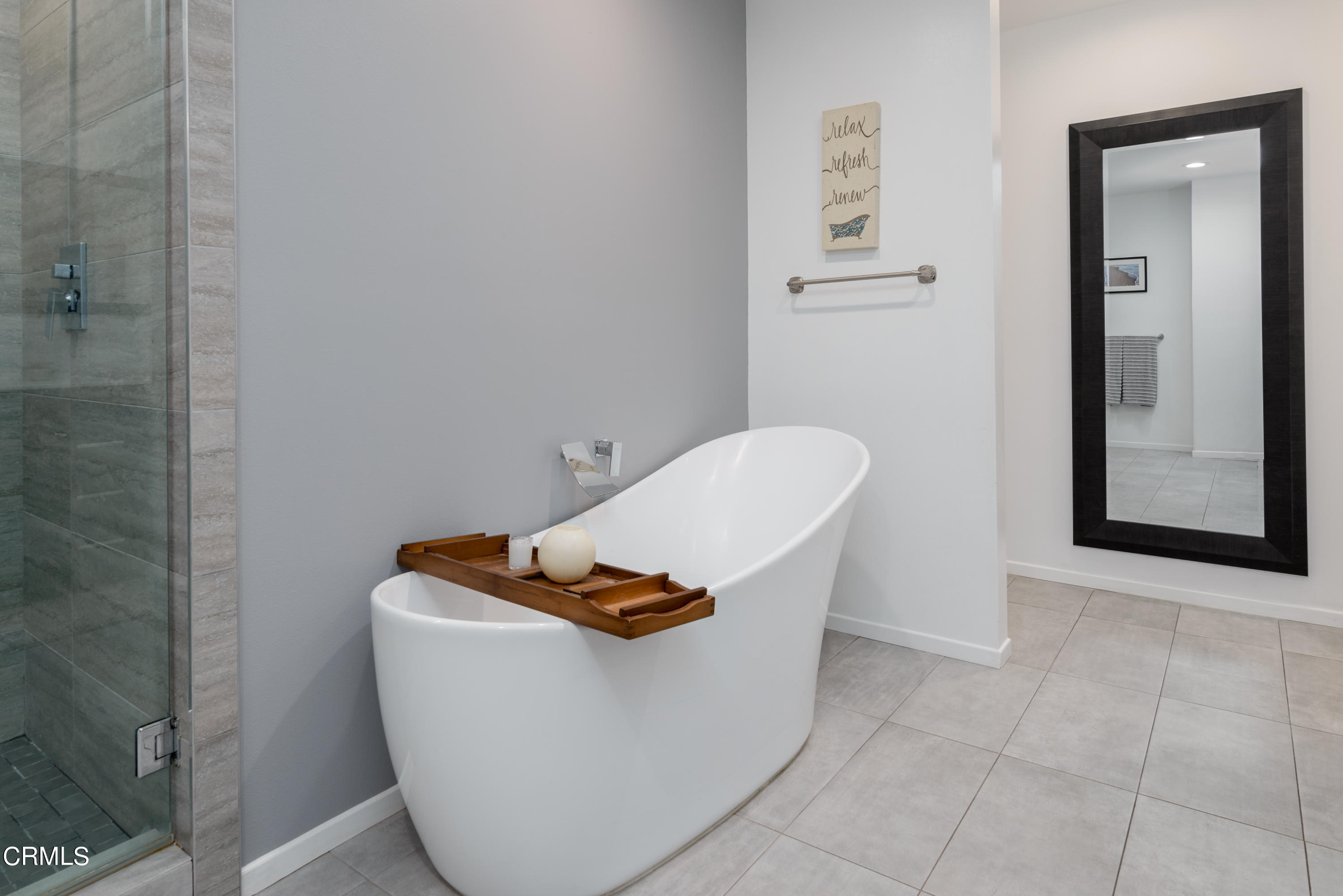 4274 Peach Slope Road Moorpark, CA 93021 - Photo 17 of 27 a white bath tub sitting in a bathroom