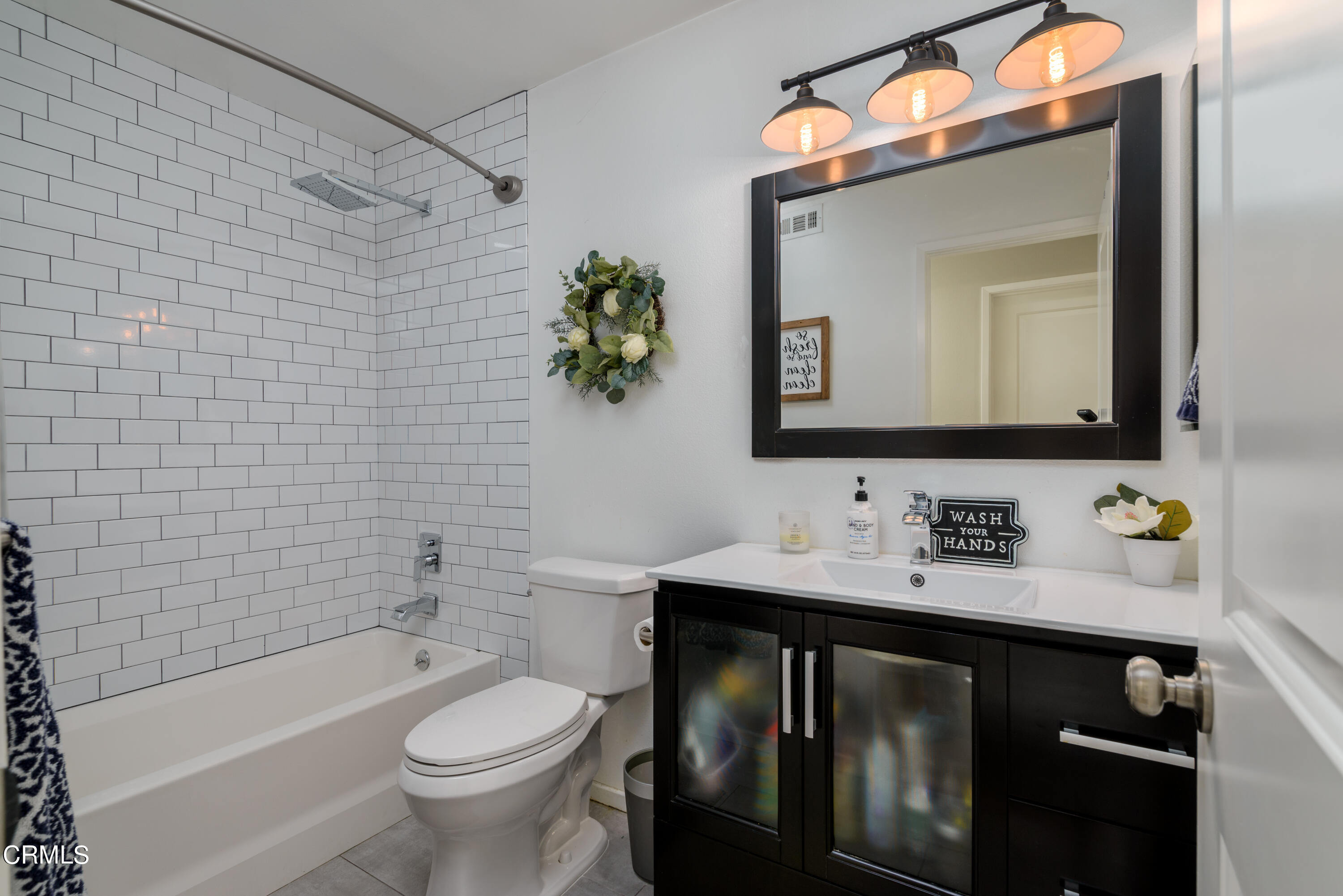 4274 Peach Slope Road Moorpark, CA 93021 - Photo 19 of 27 a bathroom with a toilet sink vanity tub and mirror
