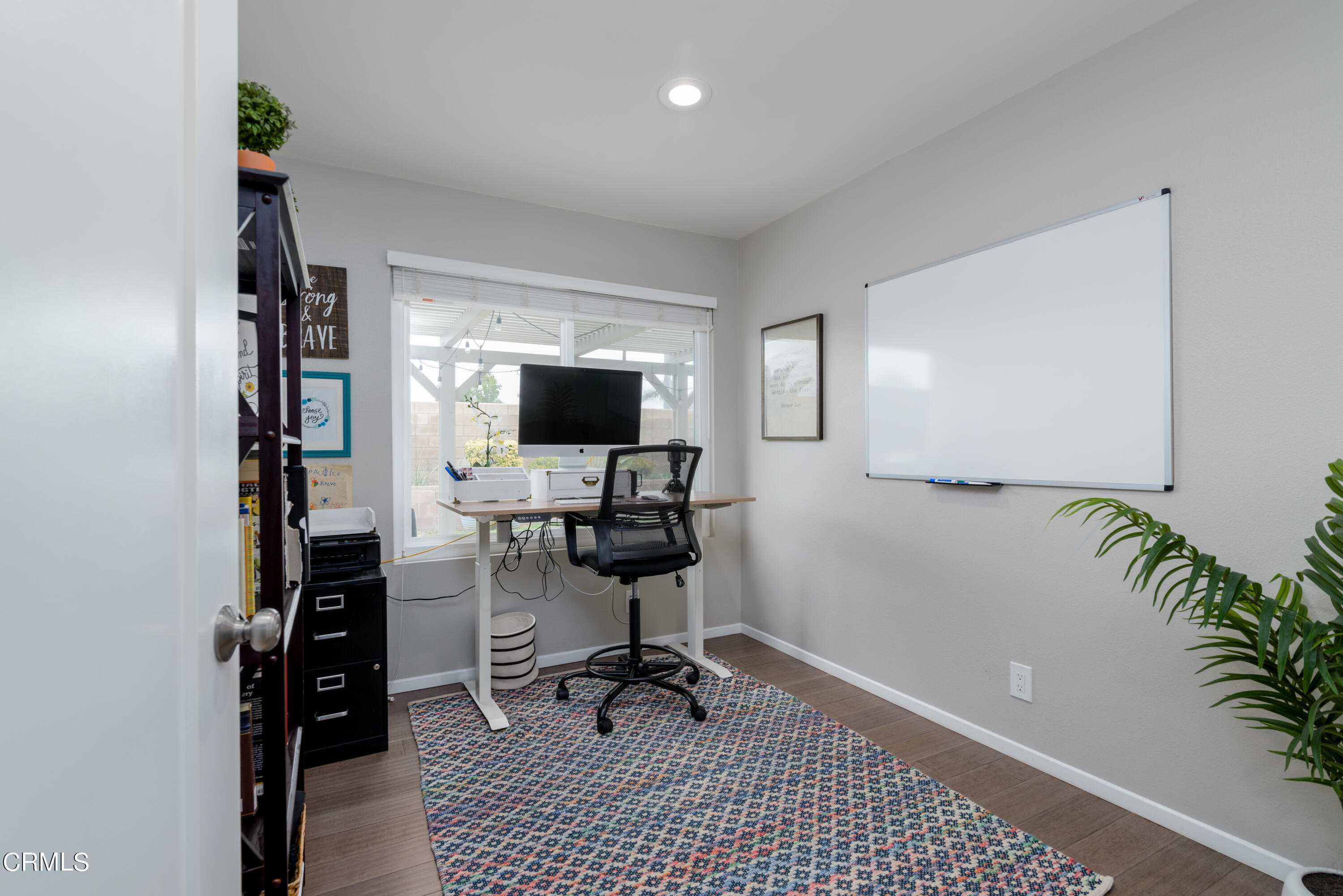 4274 Peach Slope Road Moorpark, CA 93021 - Photo 20 of 27 a view of a workspace with furniture and wooden floor