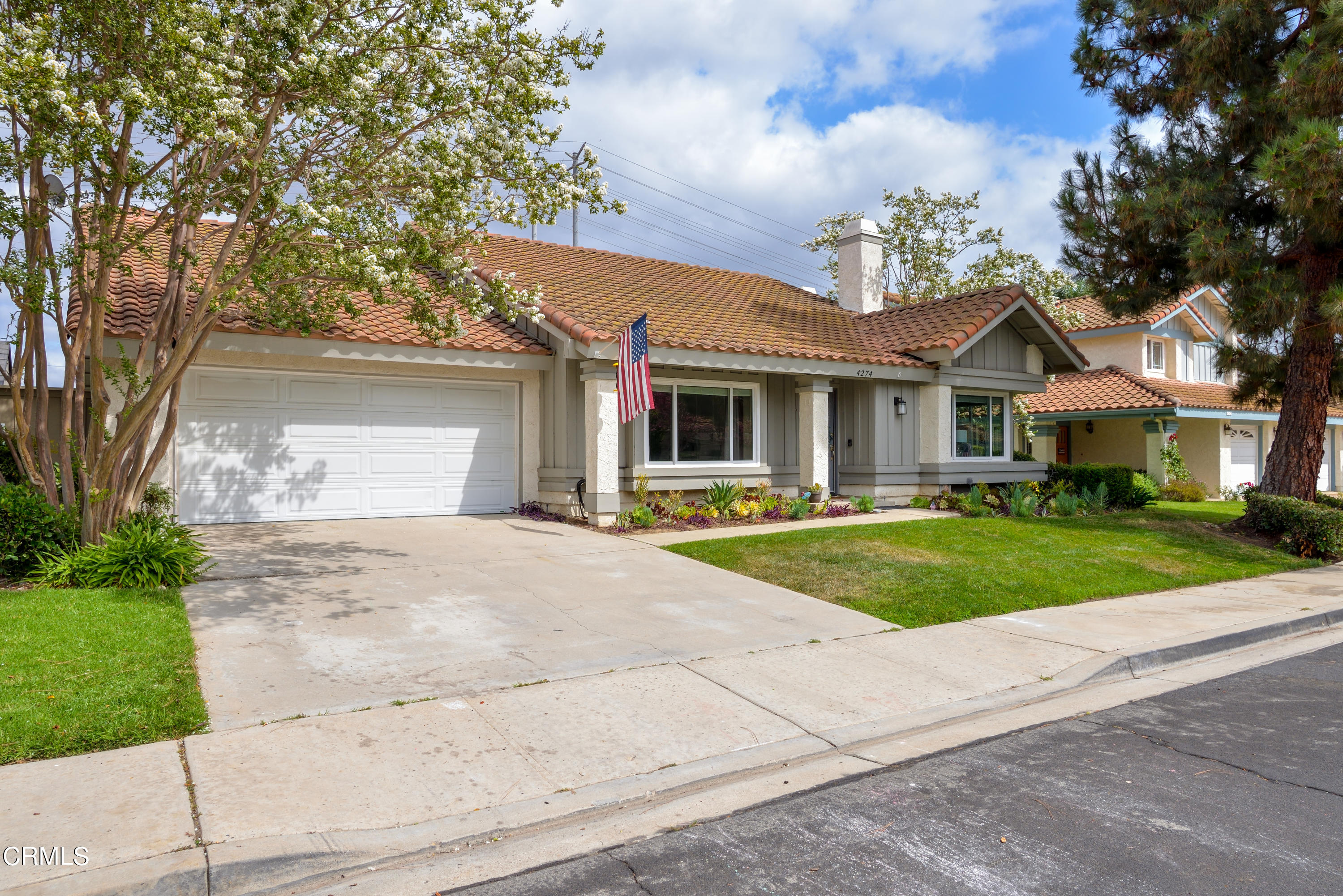 4274 Peach Slope Road Moorpark, CA 93021 - Photo 25 of 27 a front view of a house with a yard and garage