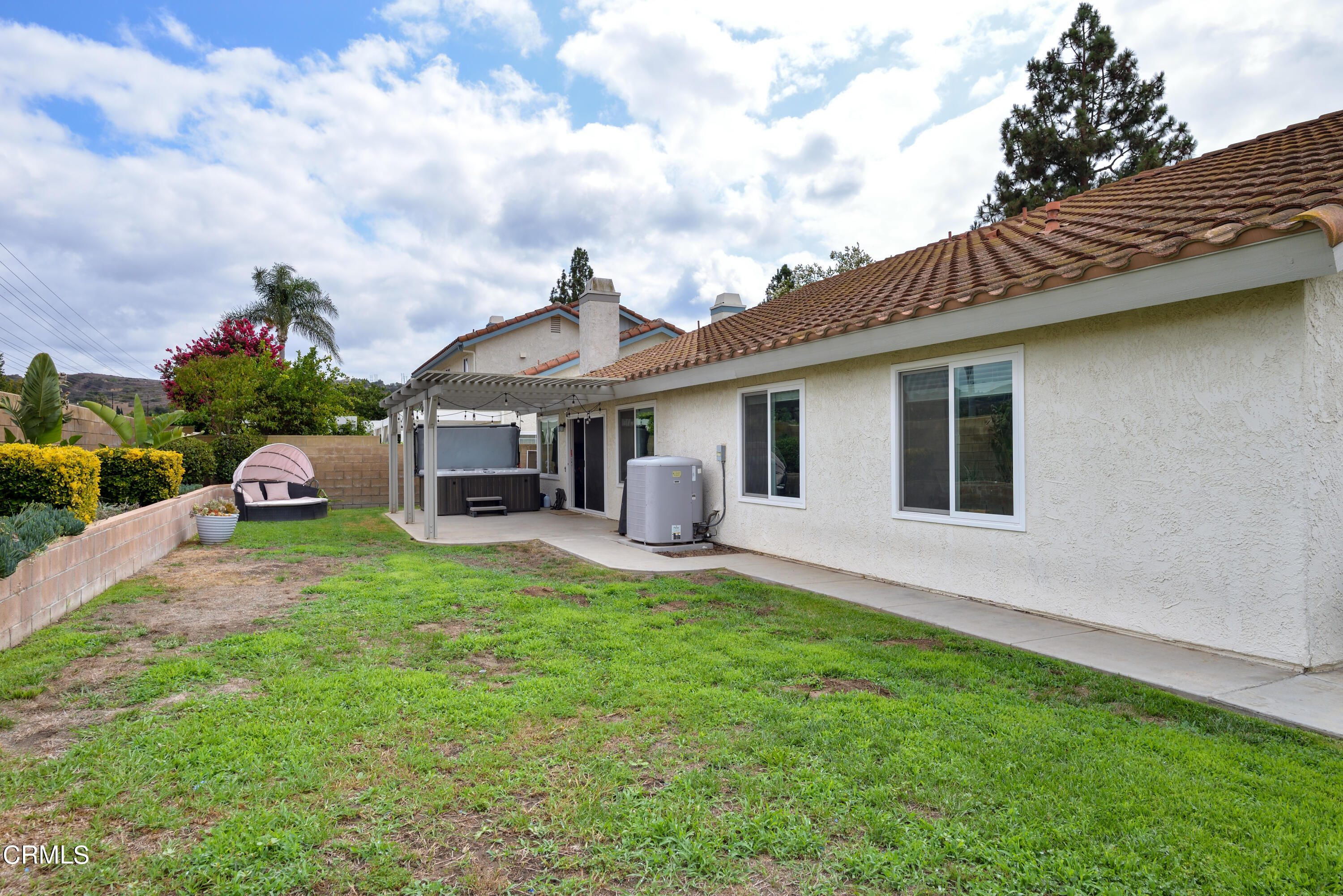 4274 Peach Slope Road Moorpark, CA 93021 - Photo 27 of 27 a front view of a house with a garden and trees