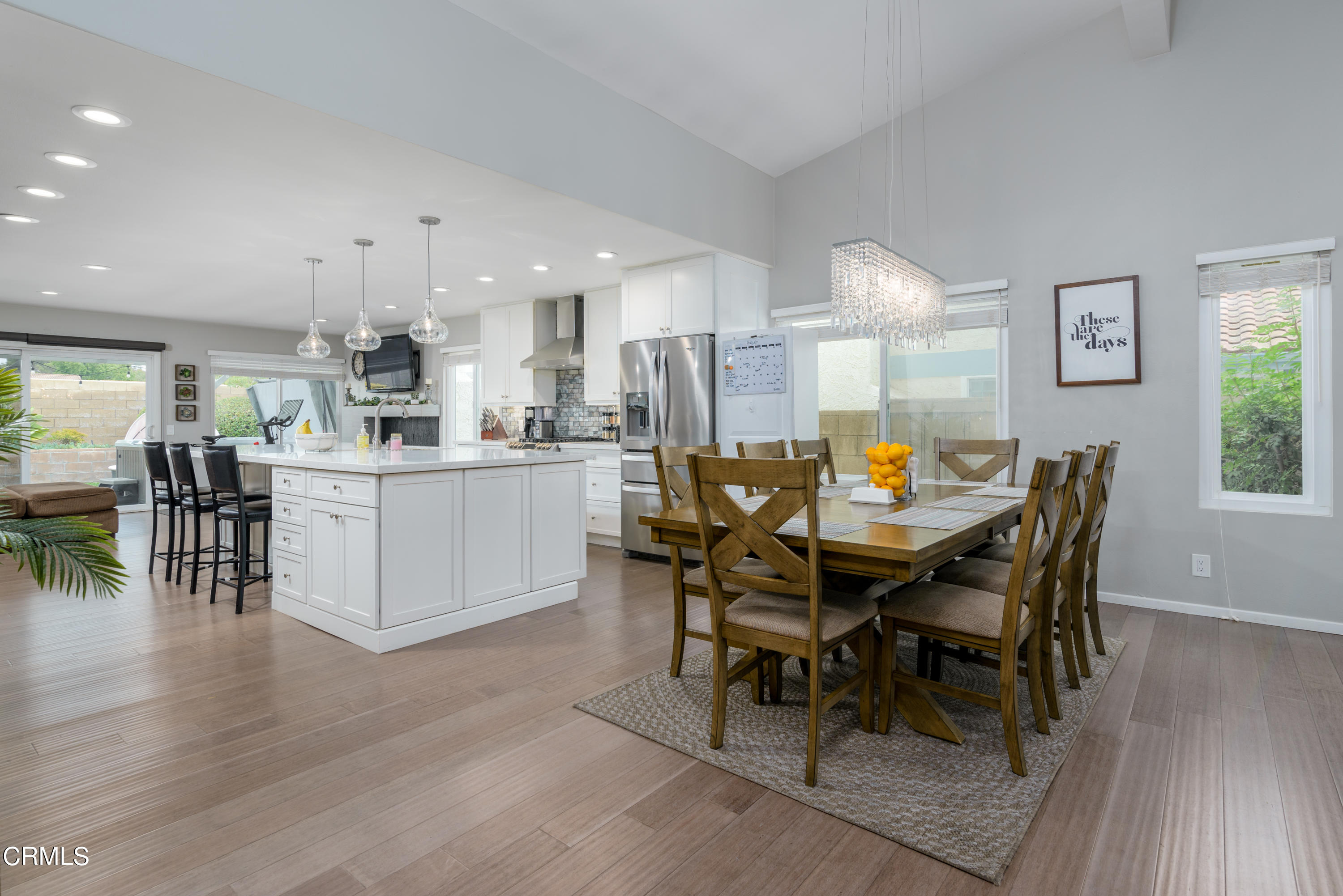 4274 Peach Slope Road Moorpark, CA 93021 - Photo 5 of 27 a dining area with a table chairs and a kitchen view