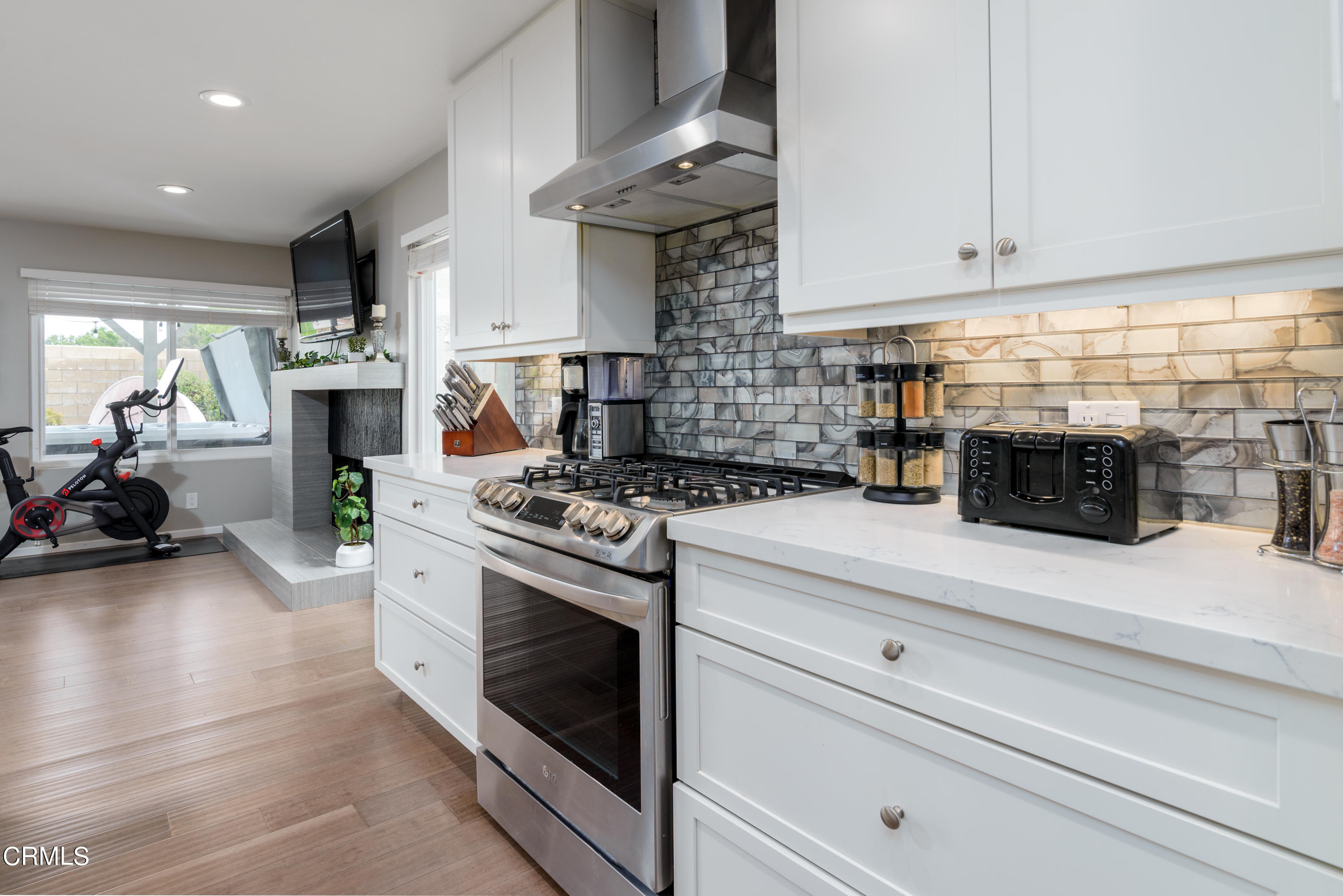 4274 Peach Slope Road Moorpark, CA 93021 - Photo 8 of 27 a kitchen with stainless steel appliances granite countertop a stove and cabinets