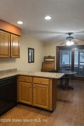 a kitchen with counter top space sink and center island