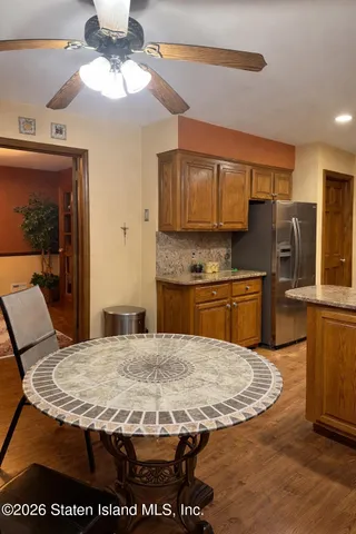 a view of kitchen with cabinets